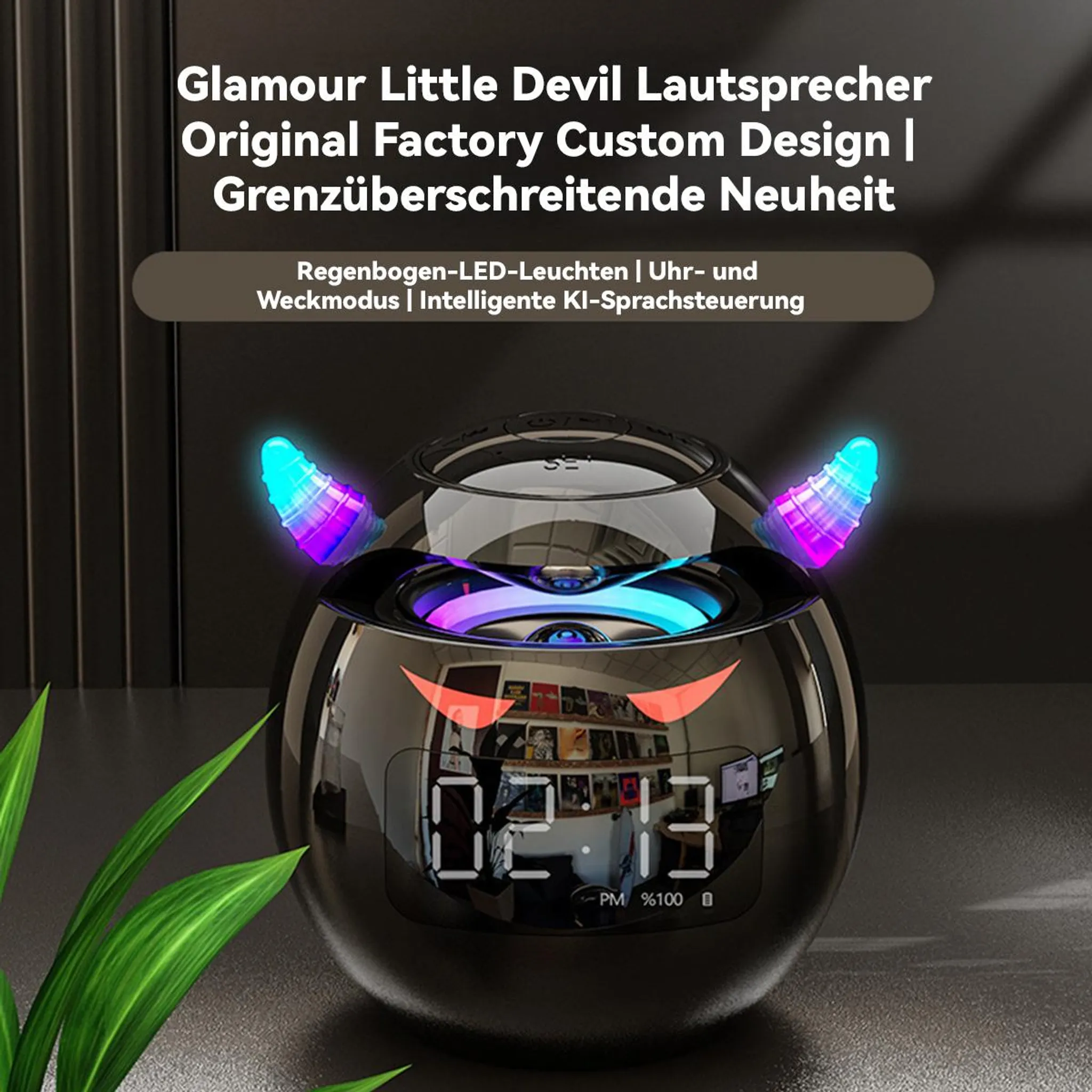 Schwarzer Lautsprecher mit Teufelshörnern, LED-Licht und Digitaluhr.