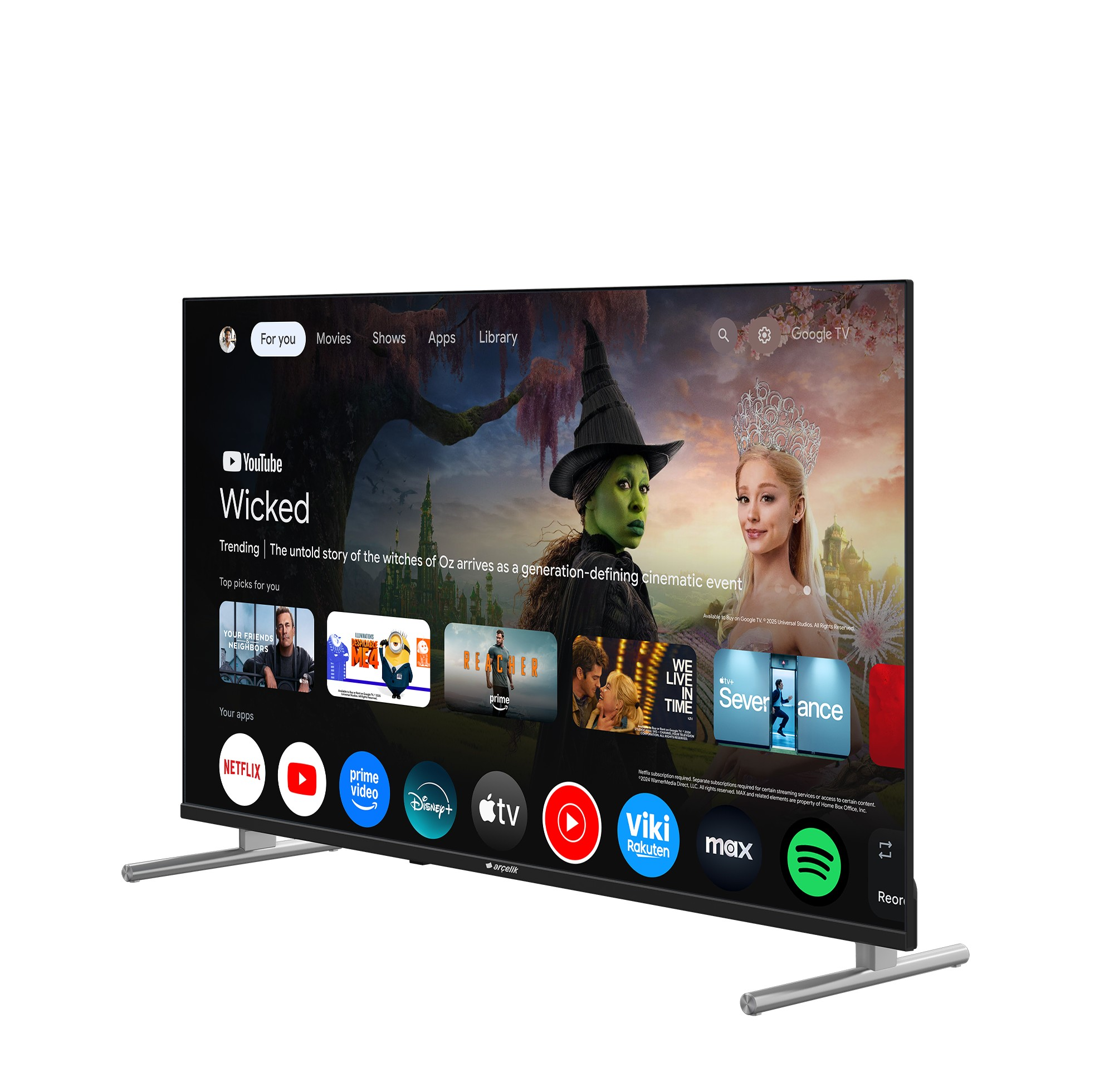 Akıllı bir TV, Wicked gibi filmlerin ve Severance gibi dizilerin yer aldığı Google TV arayüzünü gösteriyor.