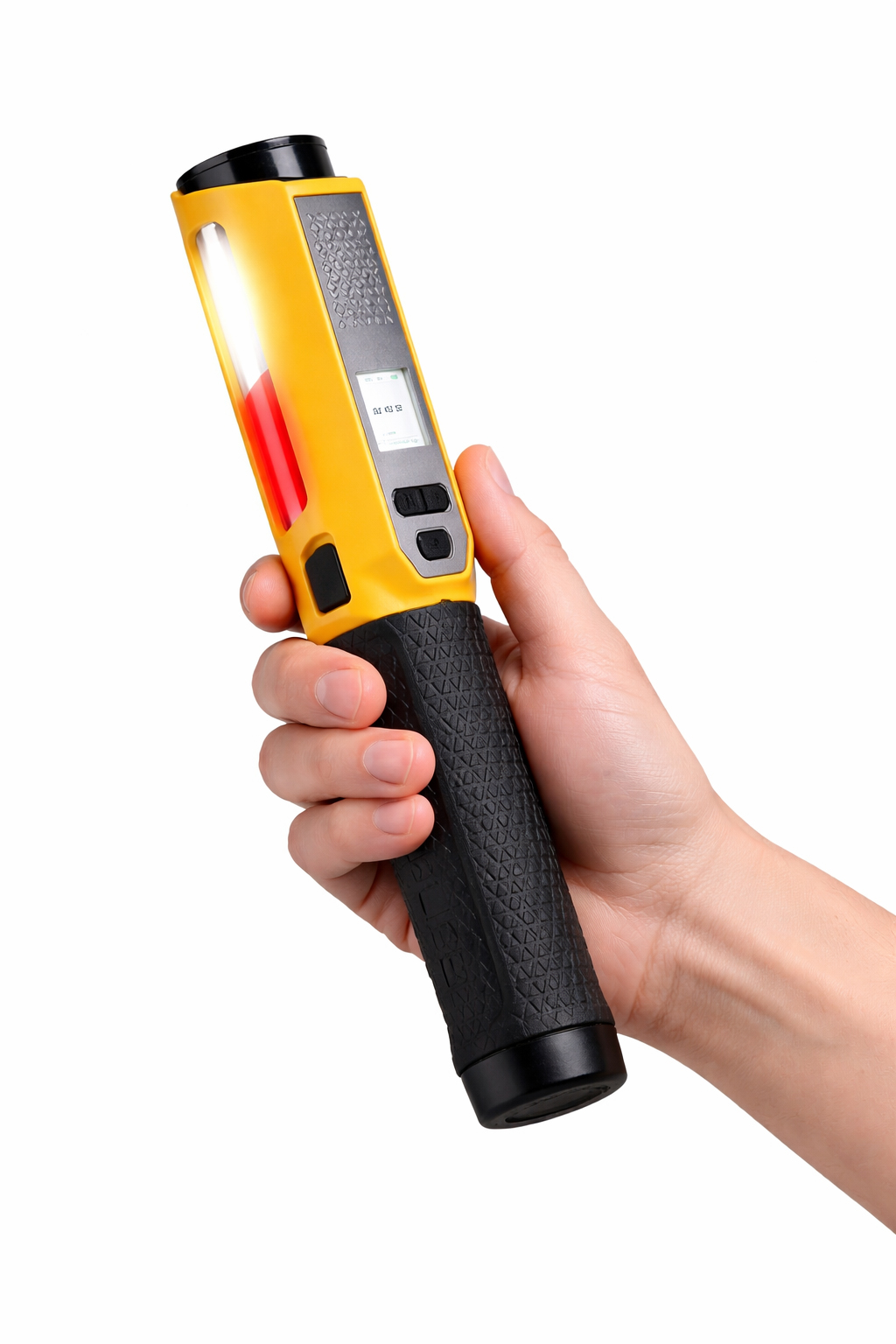 Dłoń trzyma żółte urządzenie z czarnym uchwytem i jasnym światłem.