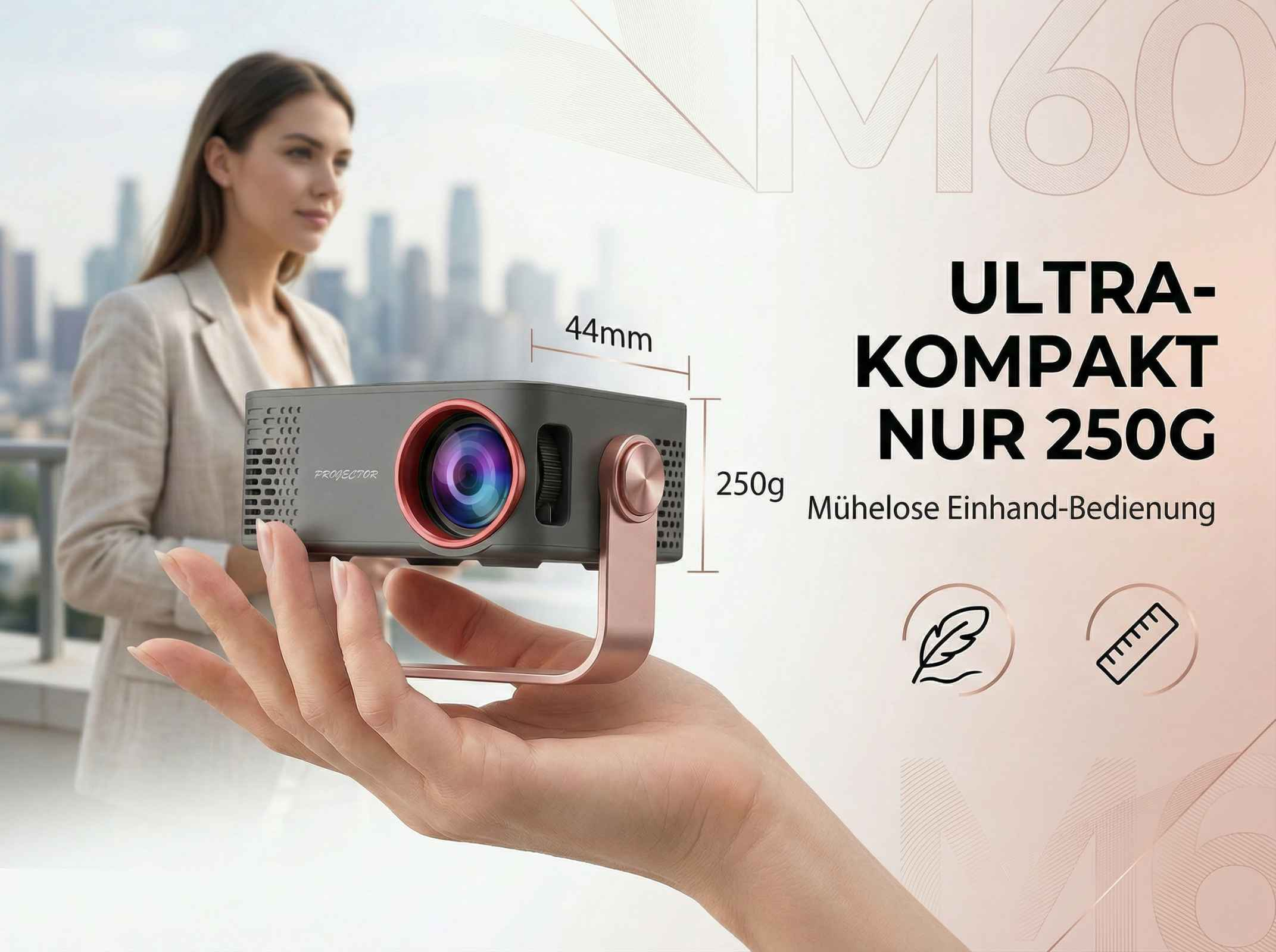 Grauer Projektor mit rotem Objektivrand wird in Hand gehalten. Maße 44mm, 250g.