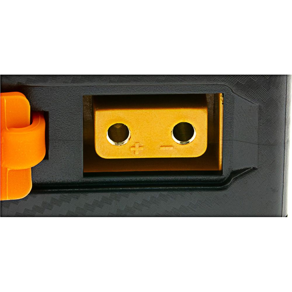 Un connettore della batteria giallo con simboli più e meno.