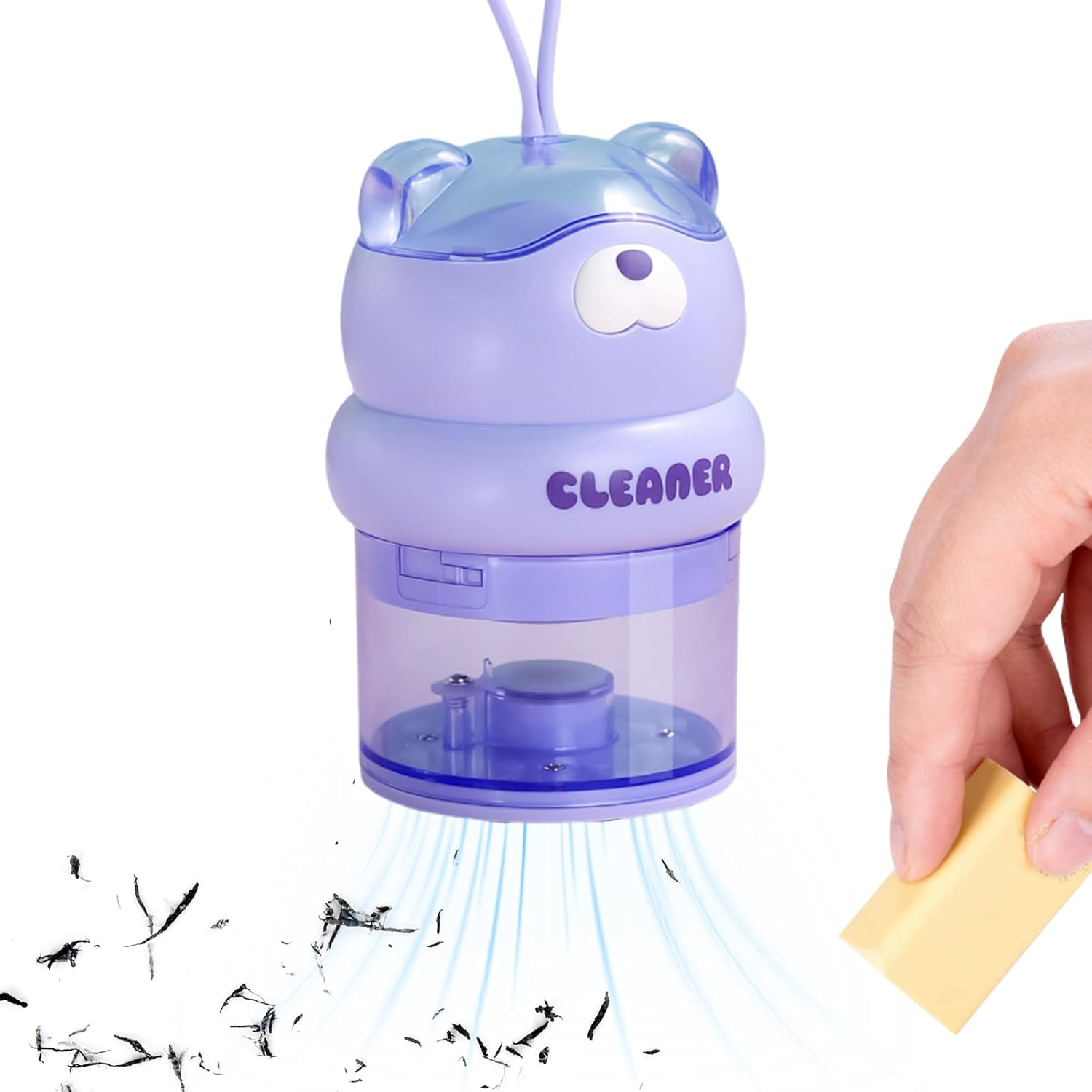 Ein lila Bären-Staubsauger saugt Radiergummi-Krümel auf. Eine Hand hält einen gelben Radiergummi.