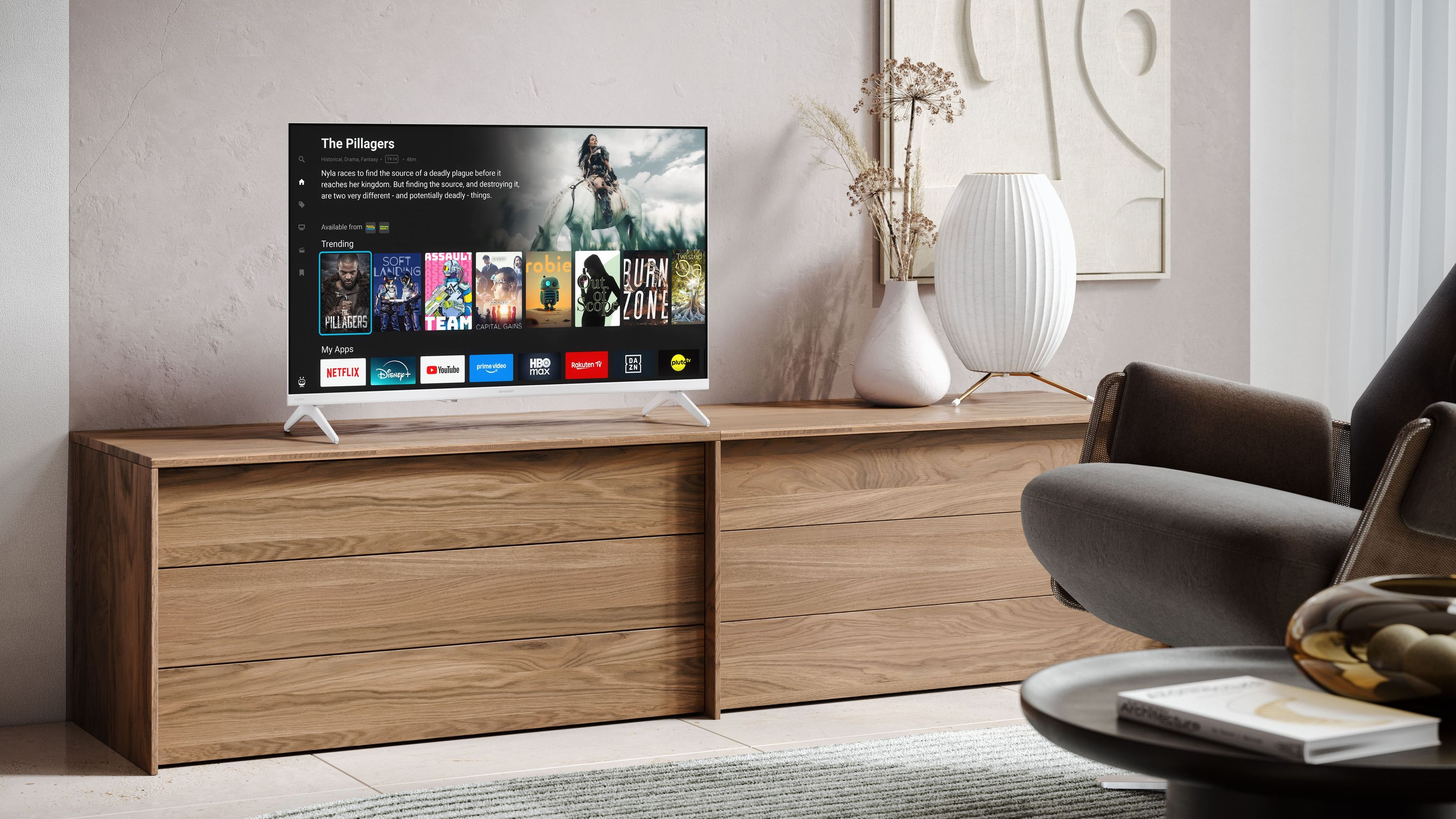 Soggiorno moderno con TV bianca che mostra film su mobile in legno.