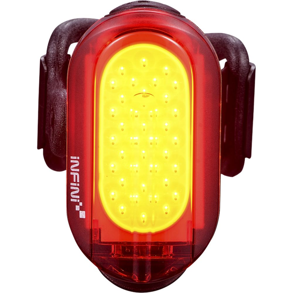 Eine rote Fahrradrückleuchte mit vielen gelben LEDs und schwarzen Halterungen.