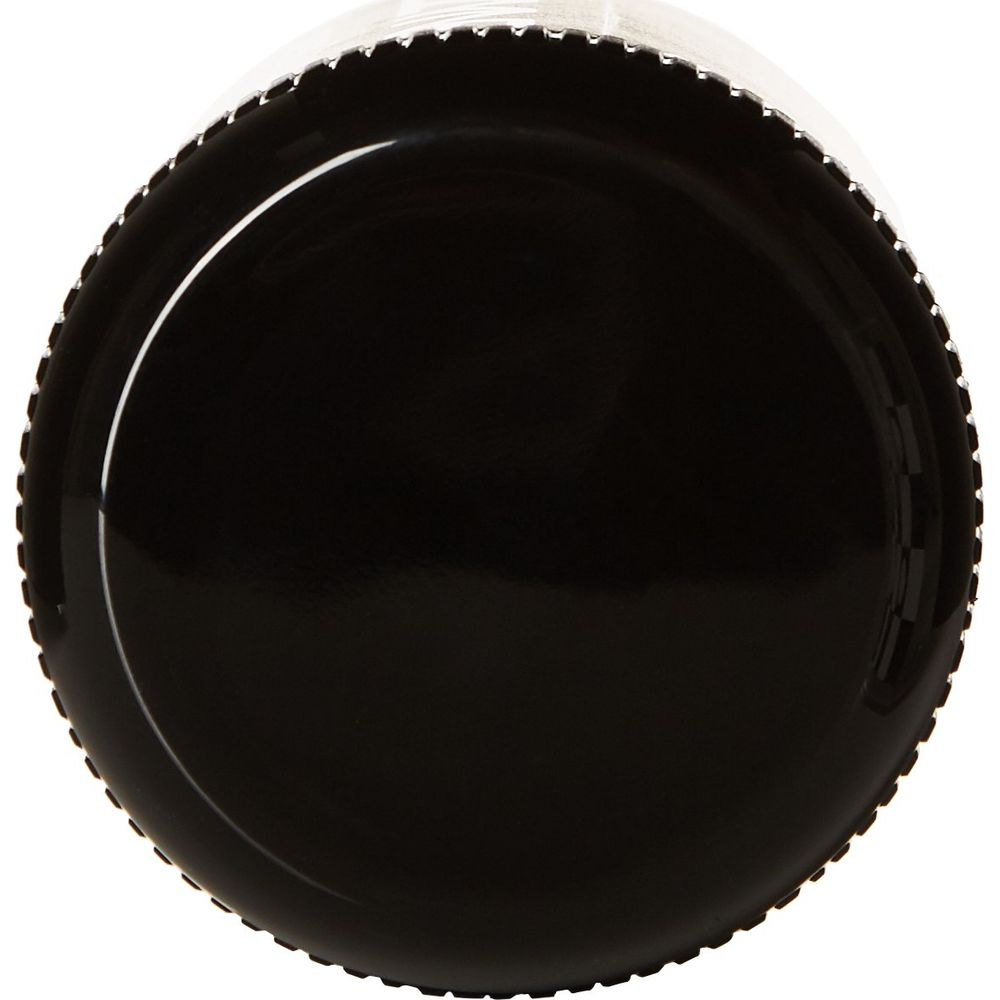 Un bouchon noir à bord denté, vu de dessus.