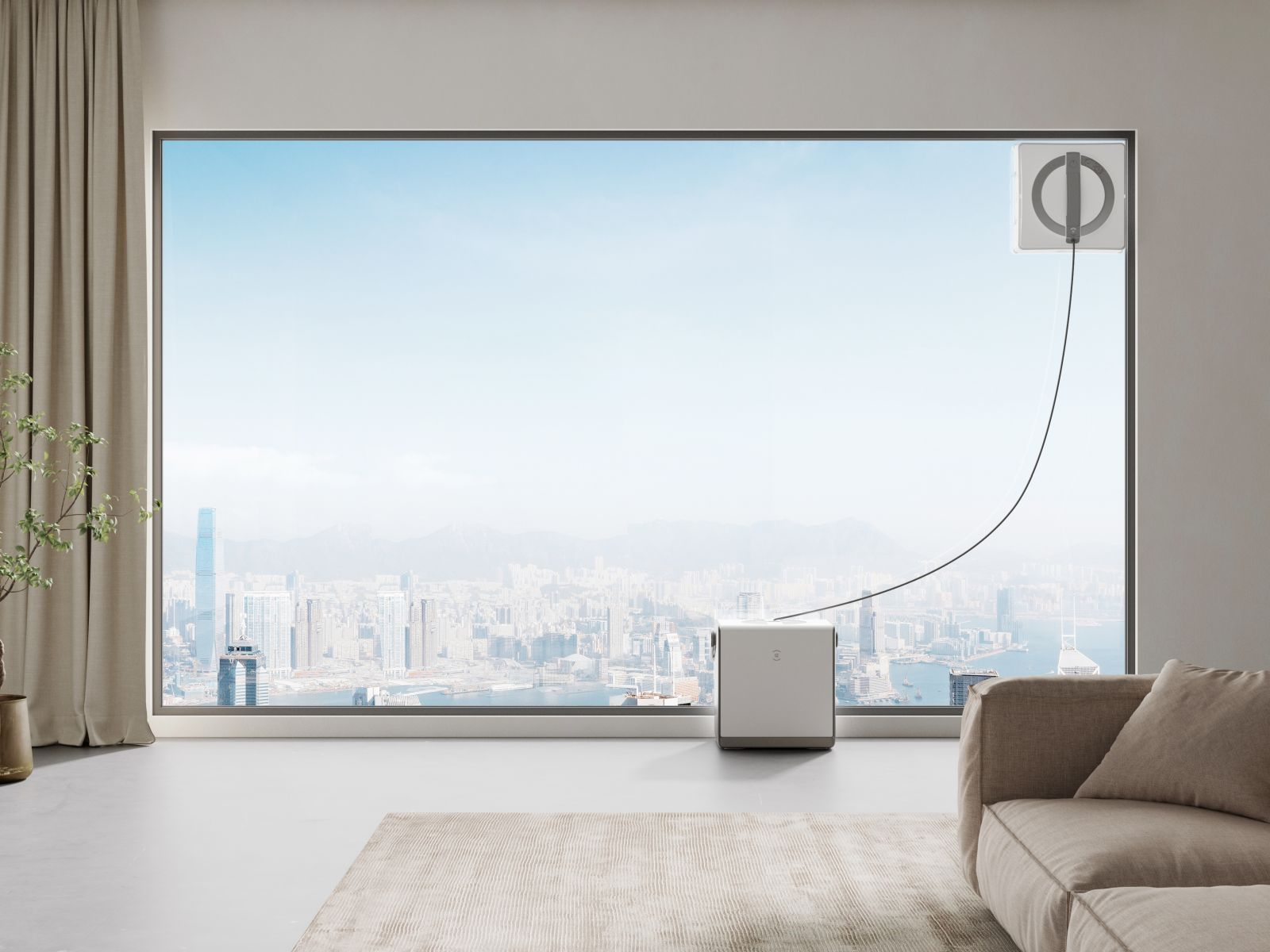 Robot do czyszczenia okien myje duże okno z widokiem na miasto.