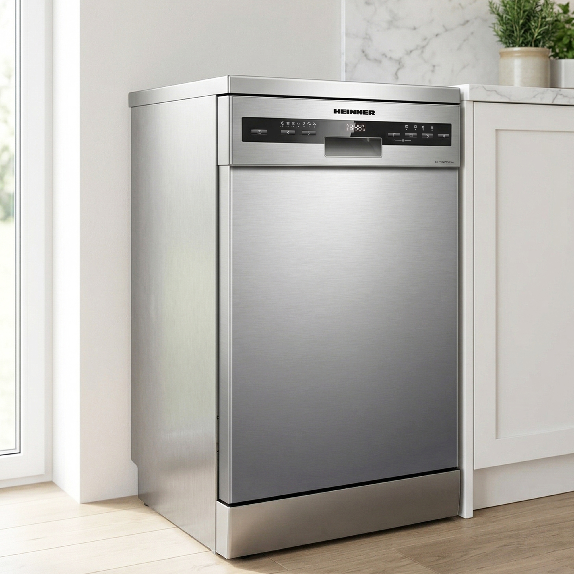 A silver dishwasher stands beside a white cabinet and a window.