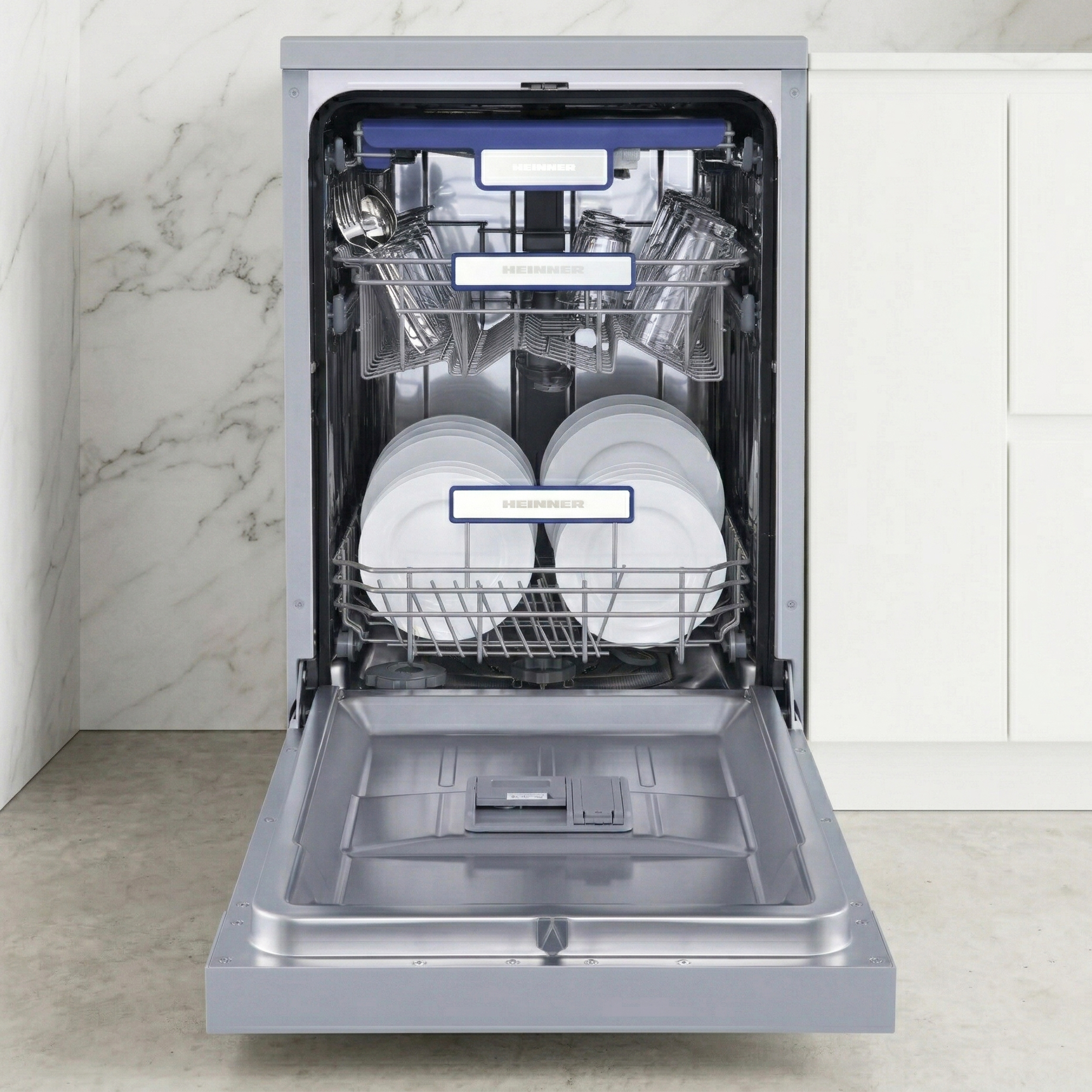 An open dishwasher with two racks, filled with plates, glasses, and cutlery.