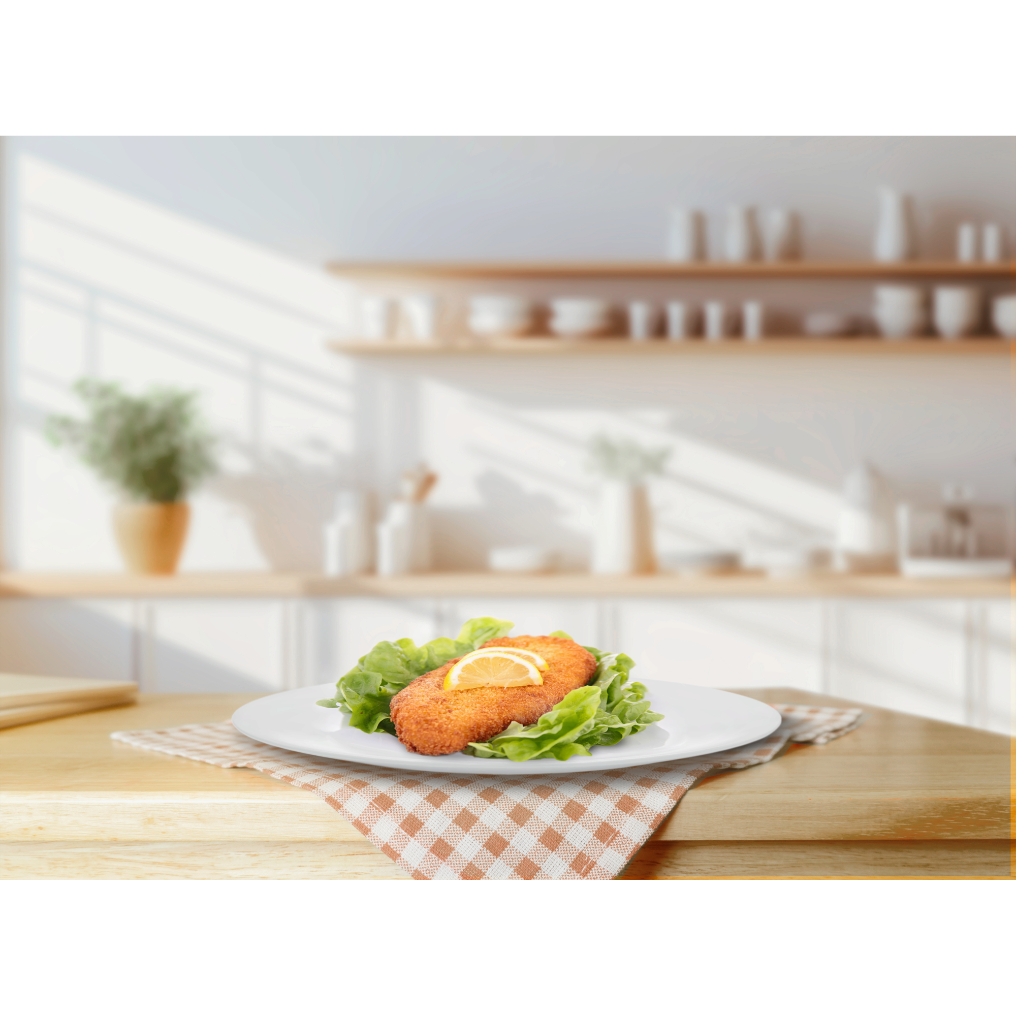 Smażony kotlet z cytryną na sałacie, podany na kratkowanej ściereczce.