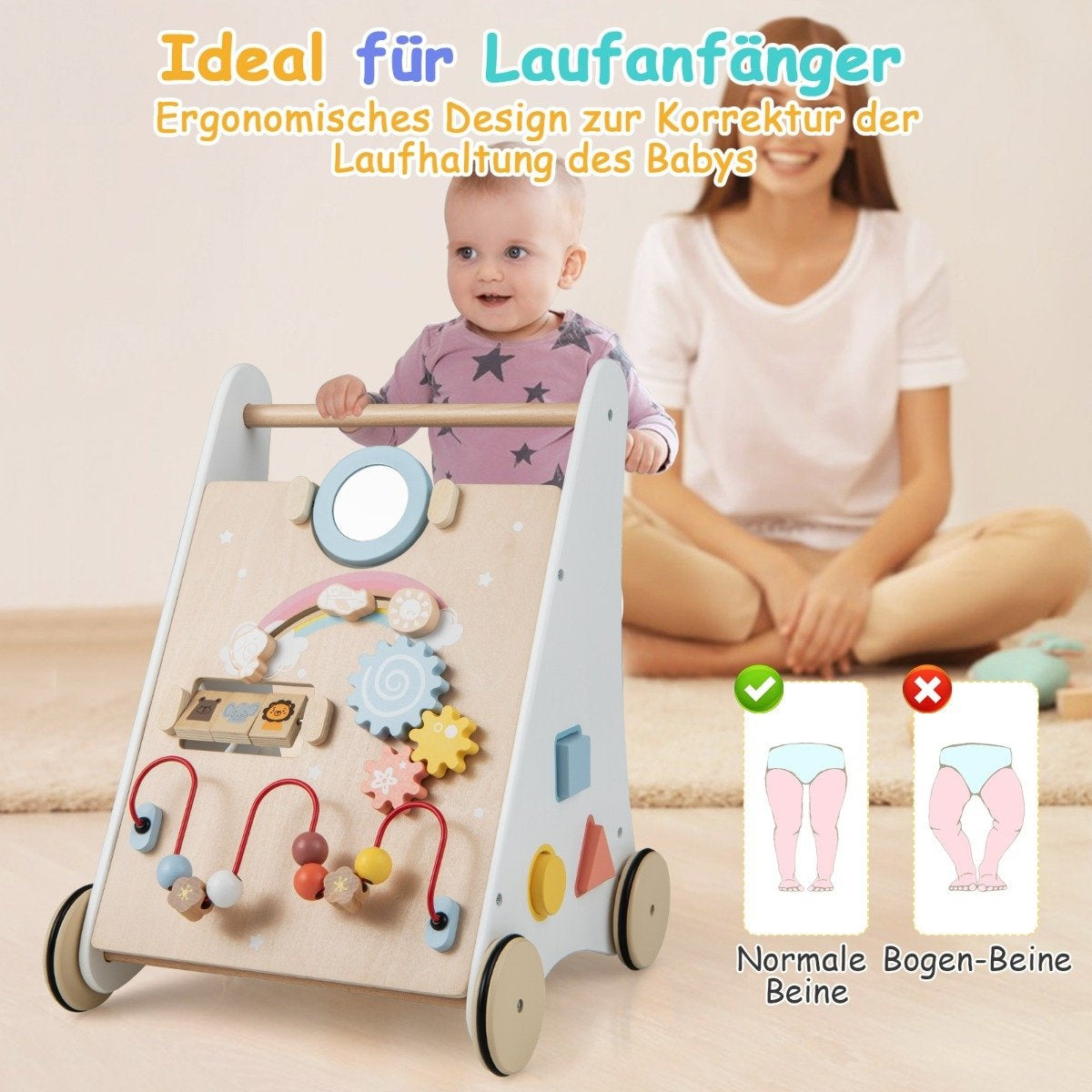 A baby plays with a wooden walker featuring colorful toys, with a woman beside them.
