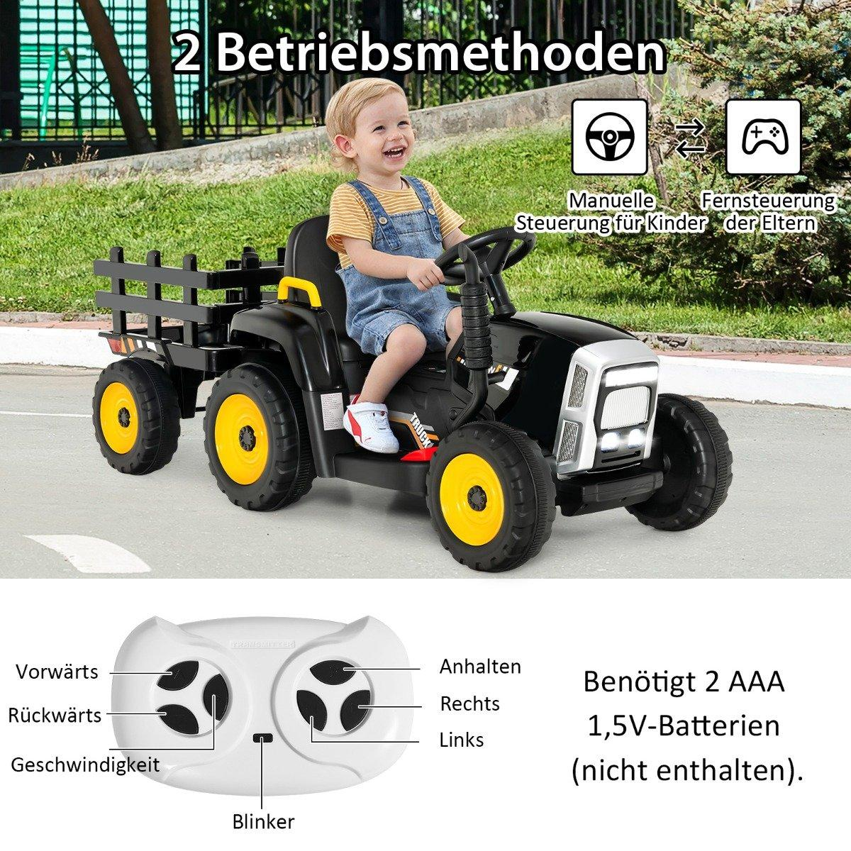 A young boy drives a black toy tractor with a trailer; a remote control is shown.