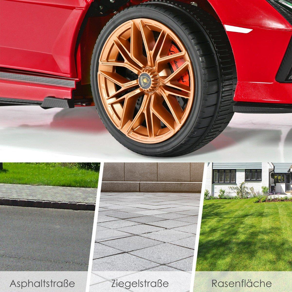 A red toy car with gold wheels on asphalt, tiles, and grass.