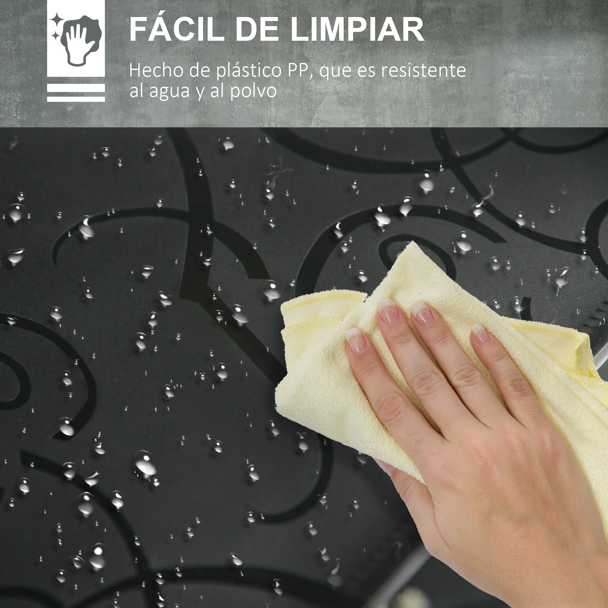 Una mano limpia una superficie oscura y mojada con un paño amarillo.