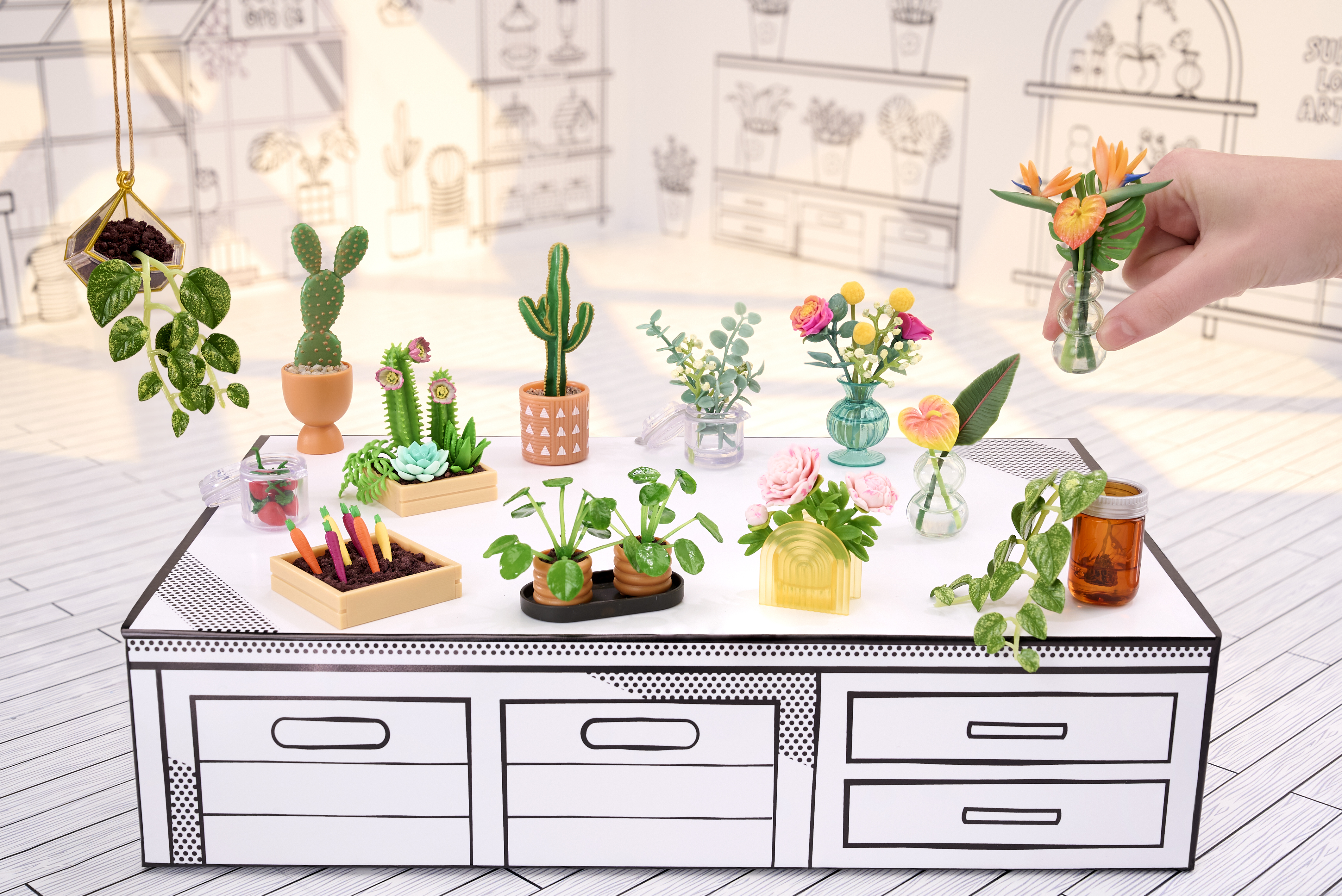 Piante e fiori in miniatura su un tavolo bianco e nero in un ambiente disegnato.