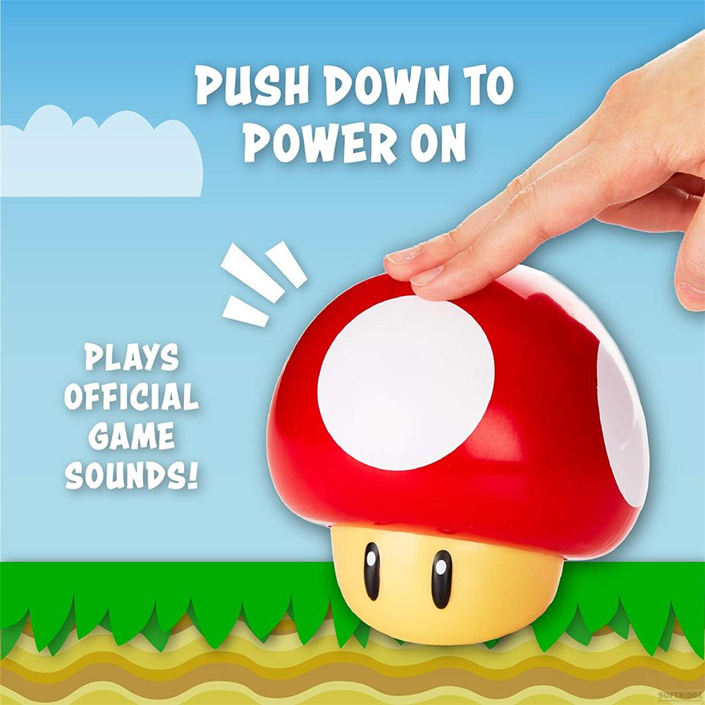 Una mano presiona un botón rojo de hongo, con texto 'Push Down to Power On'.