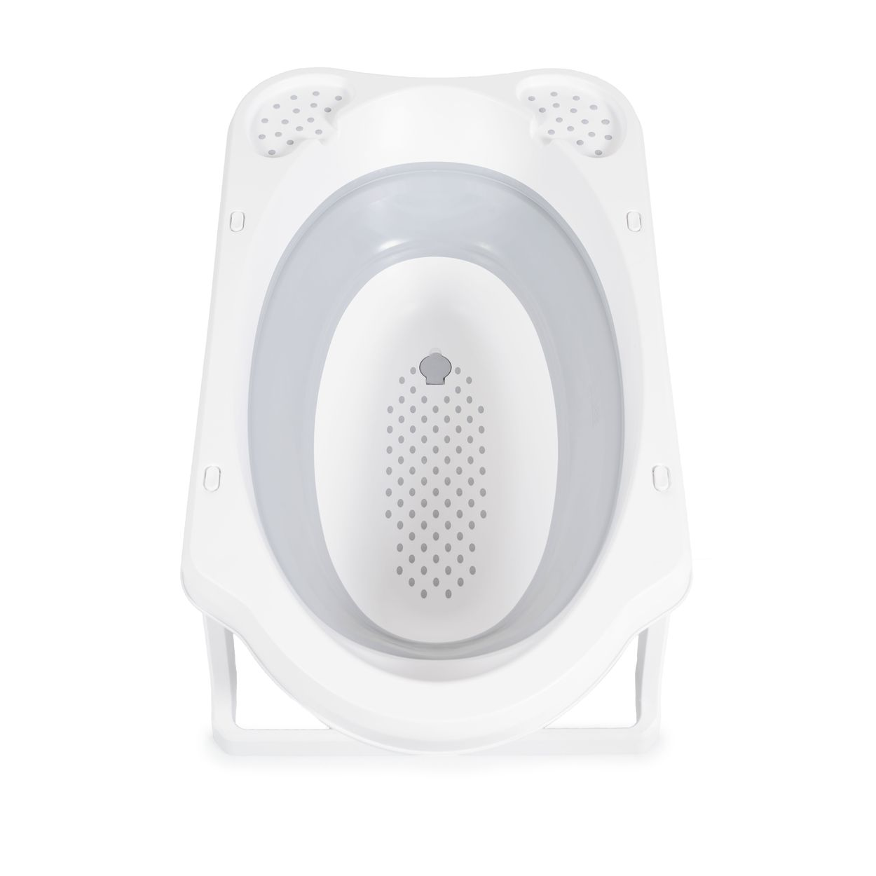 Eine weiße Babybadewanne mit rutschfester Unterlage und Drainageloch.