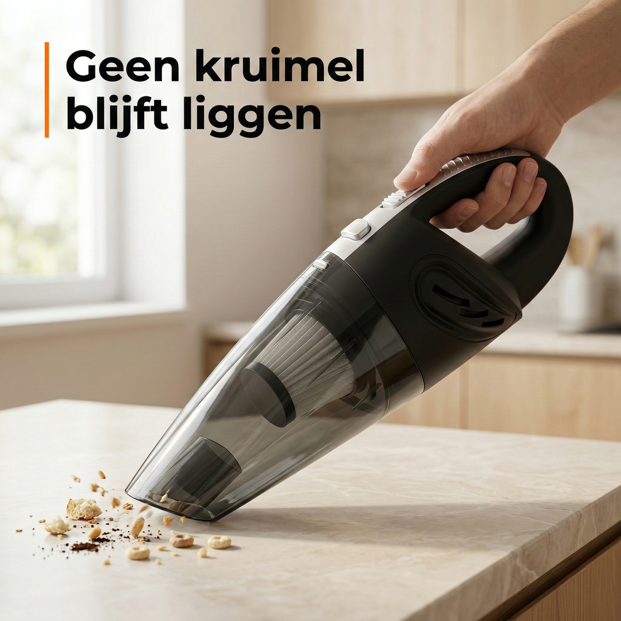 A black handheld vacuum cleaner is shown sucking up crumbs from a kitchen countertop.