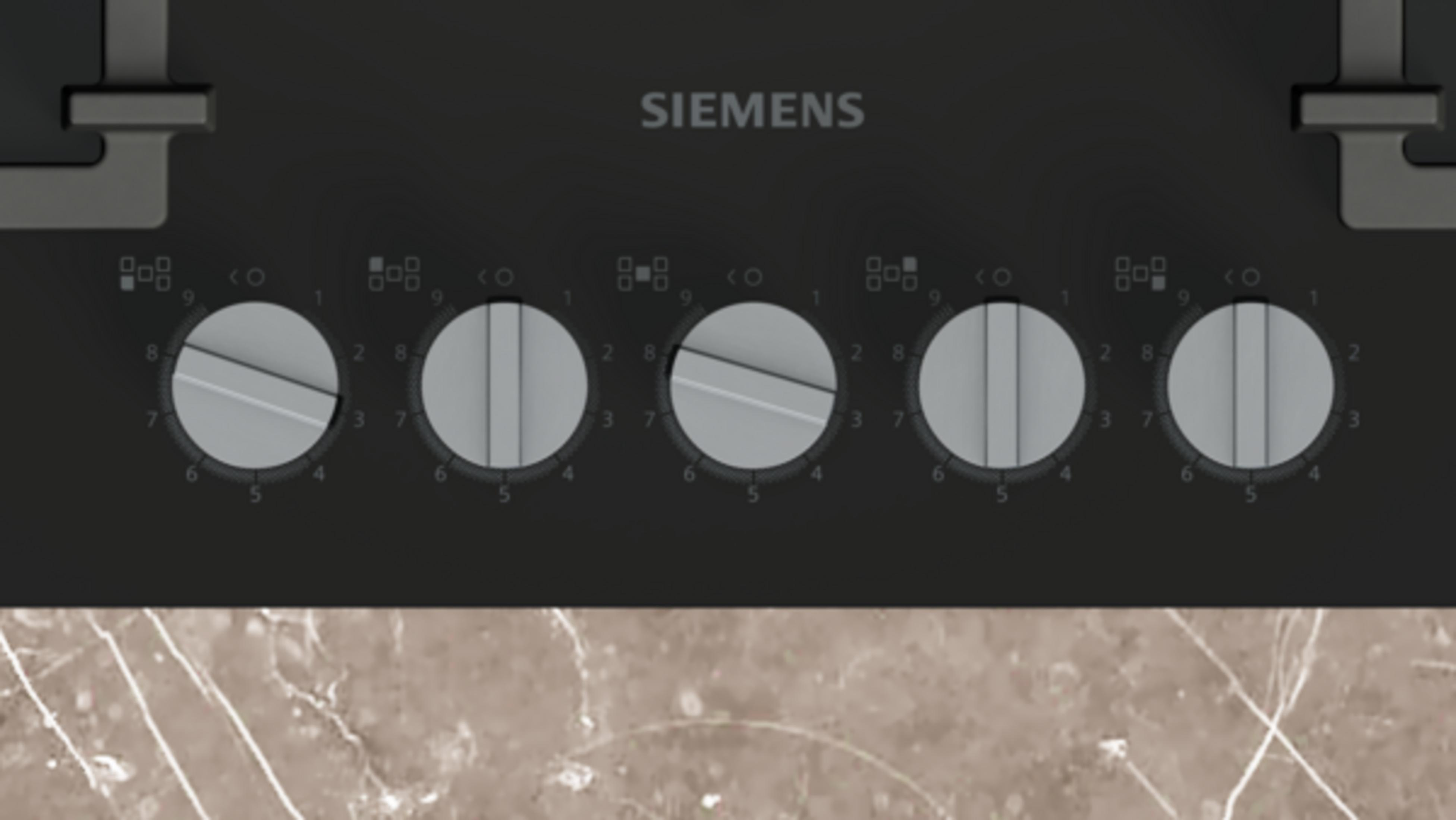 Siemens ocak, mermer tezgah üzerinde beş düğme ve pişirme sembolleri bulunur.