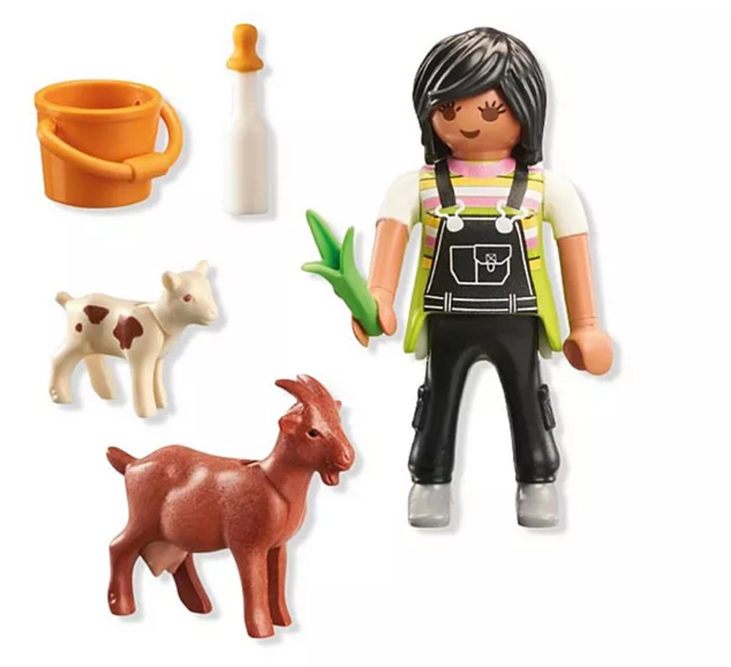 Eine Spielfigur mit Ziegen, Eimer und Flasche.