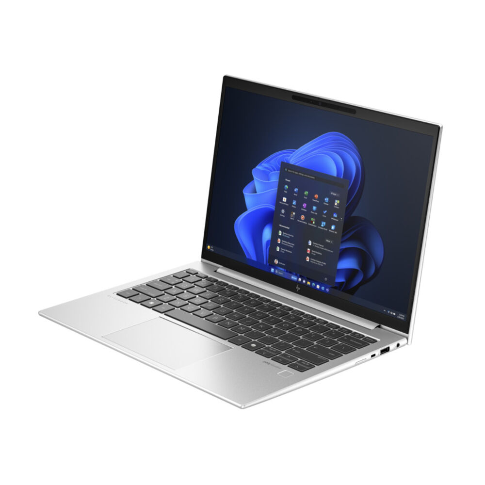 Windows 11 gösteren açık ekranlı gümüş bir dizüstü bilgisayar.