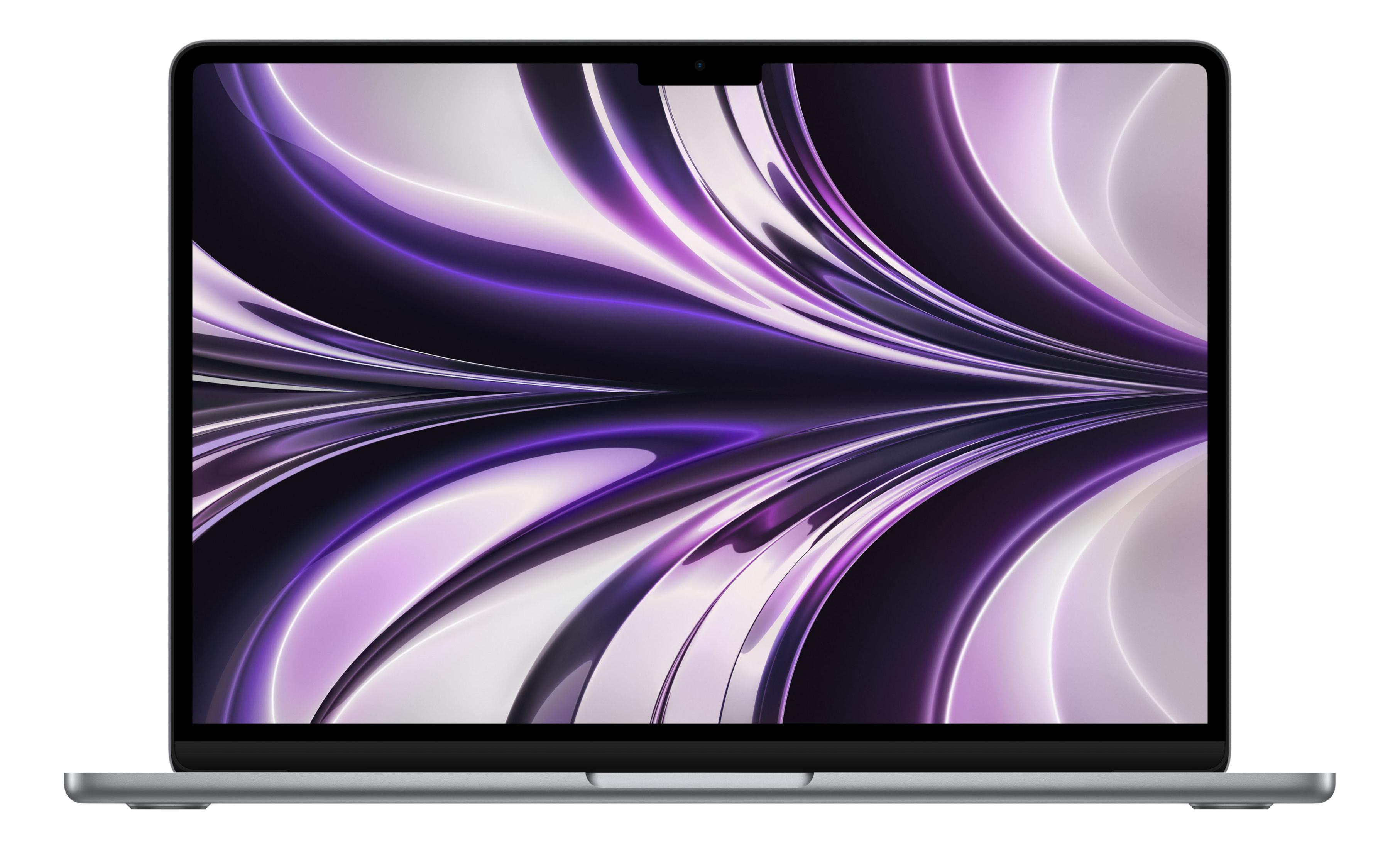 Un laptop argentato aperto con uno sfondo viola e bianco.