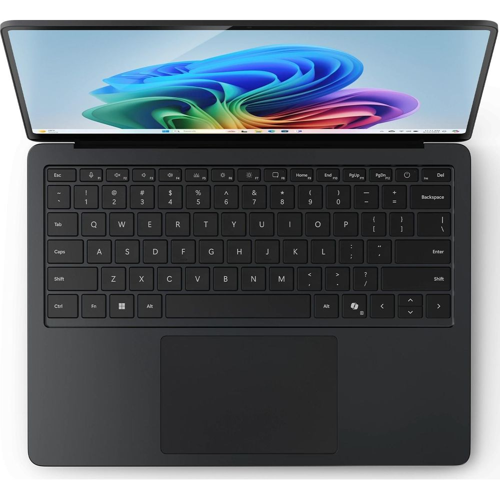 Un ordinateur portable noir est ouvert, montrant le clavier et un fond d'écran abstrait coloré.
