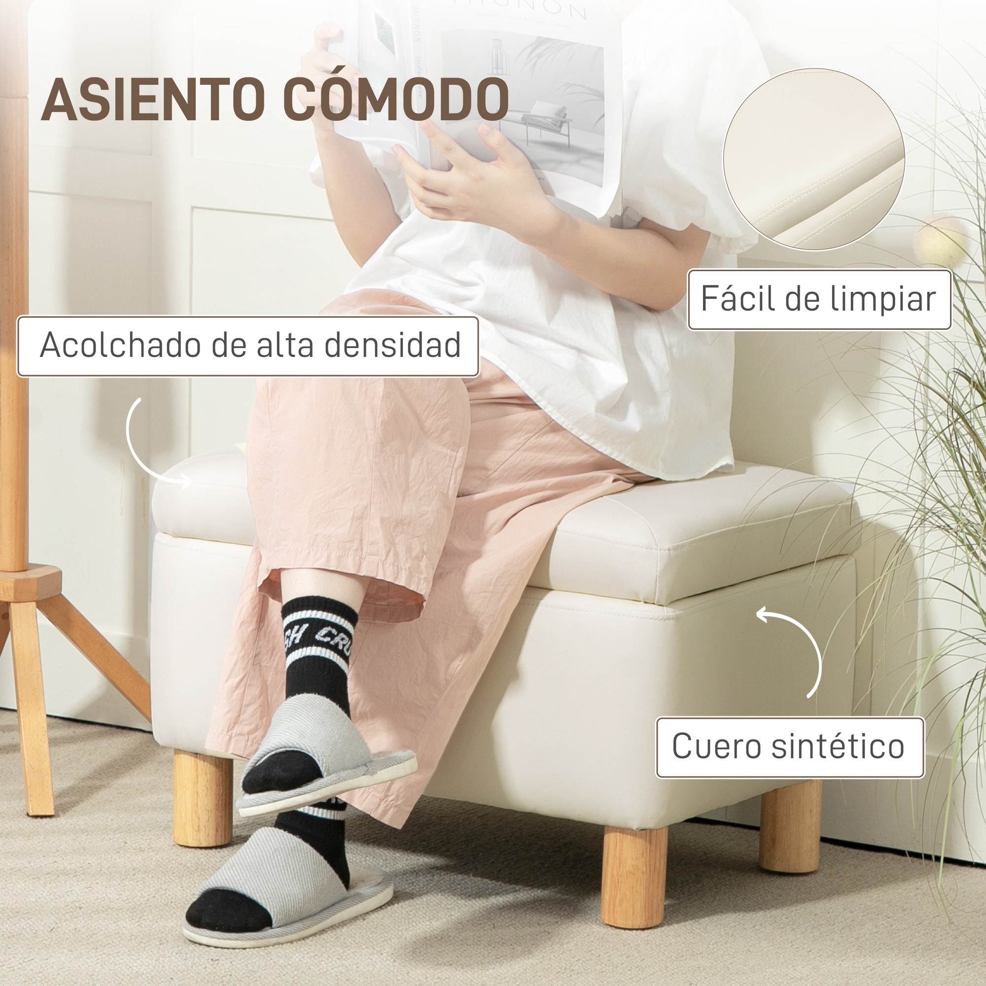 Una persona sentada en un puf blanco, leyendo un libro, con zapatillas.