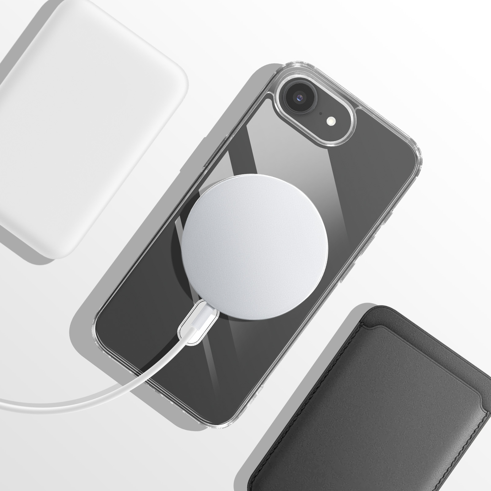 Een doorzichtige telefoon met witte oplaadkabel, oplaadpad en zwarte hoes.