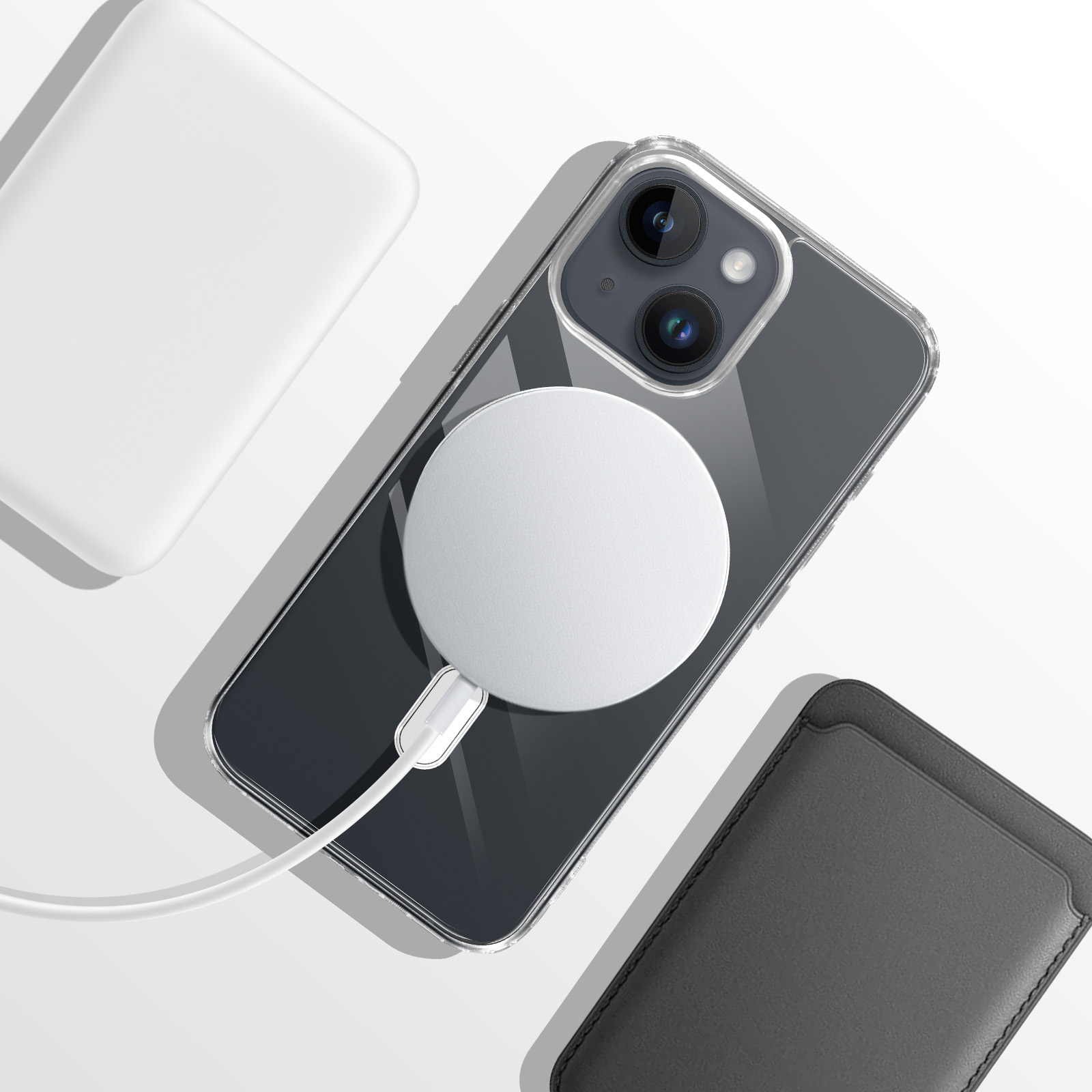 Un iPhone avec chargeur MagSafe, câble blanc, porte-cartes noir et batterie blanche.