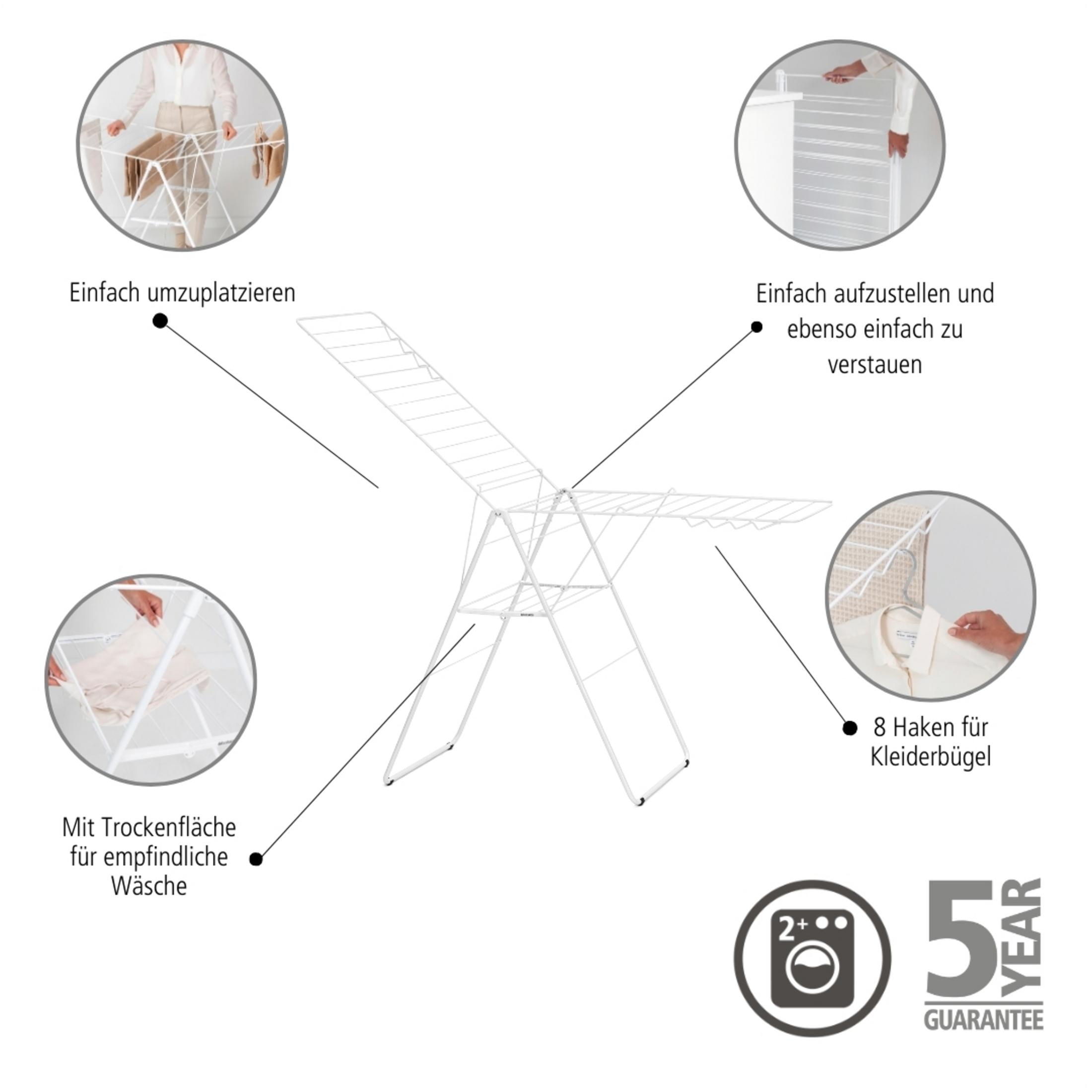 A white multi-tiered clothes drying rack with a 5-year guarantee.