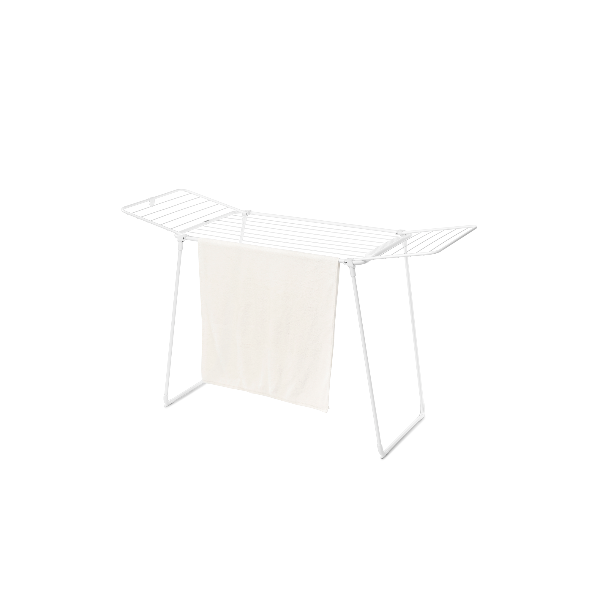 A white drying rack with a light beige towel hanging on it for drying.