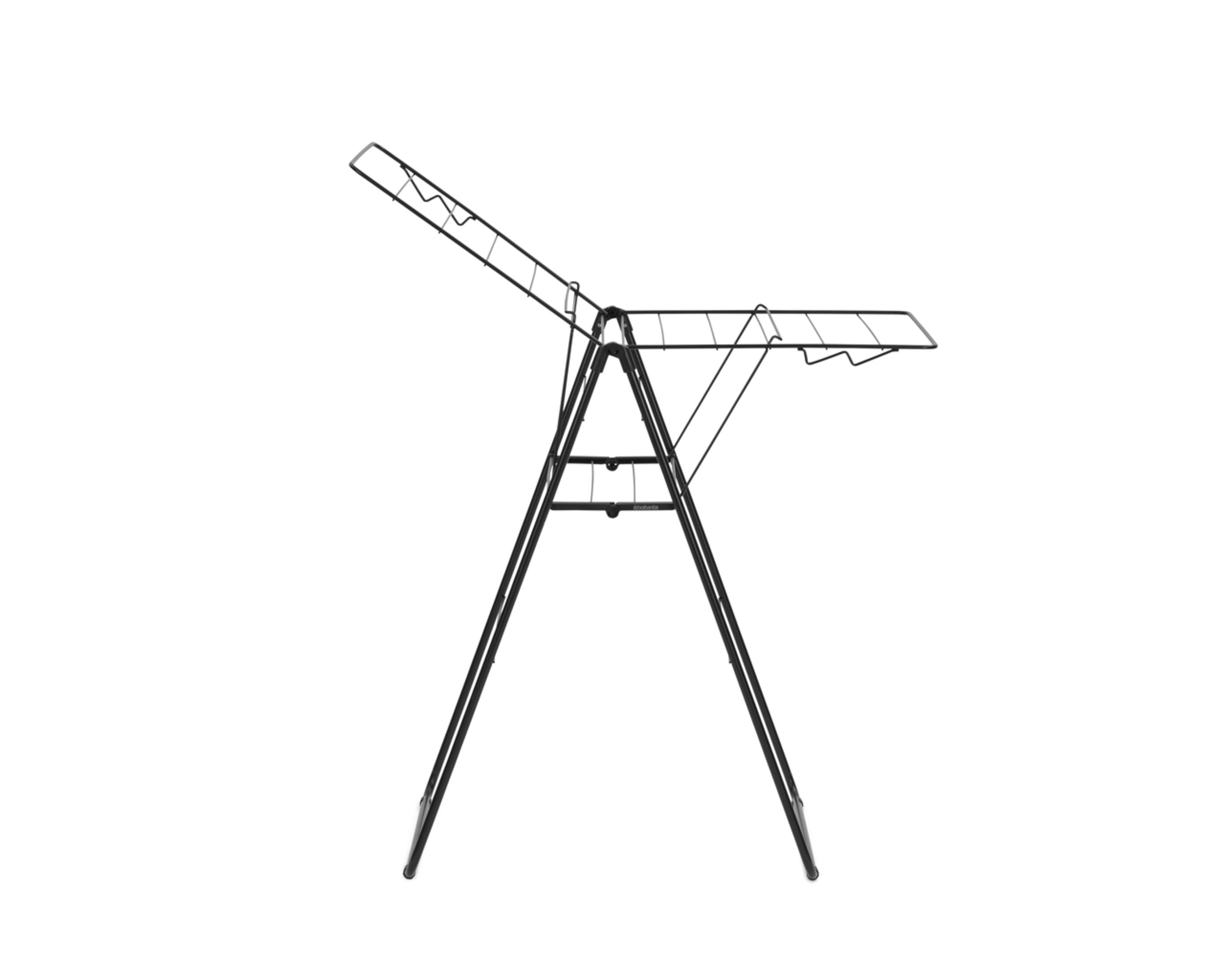 A black drying rack with foldable wings stands on a white background.