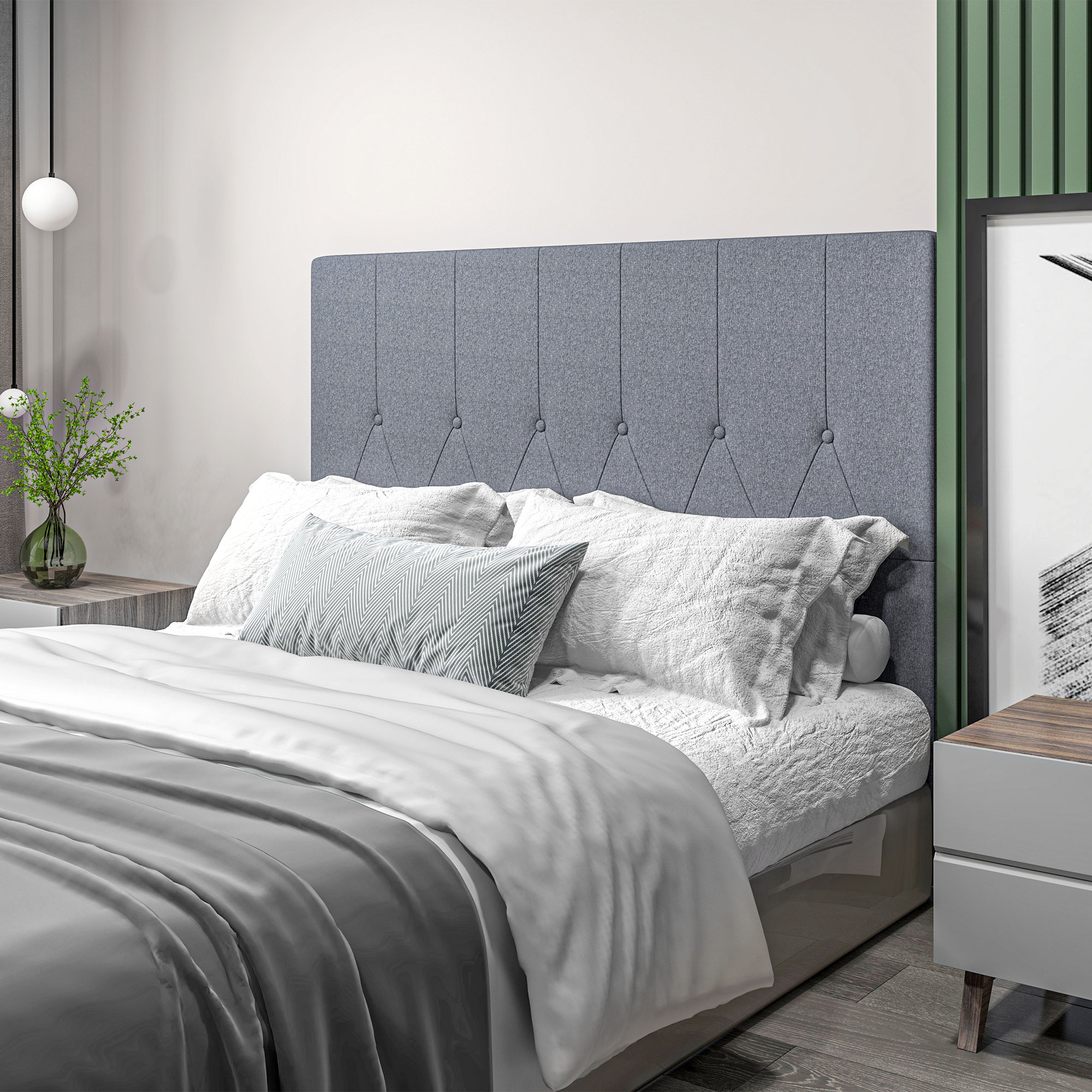 Un dormitorio moderno con cabecero gris, ropa de cama blanca y mesita de noche.