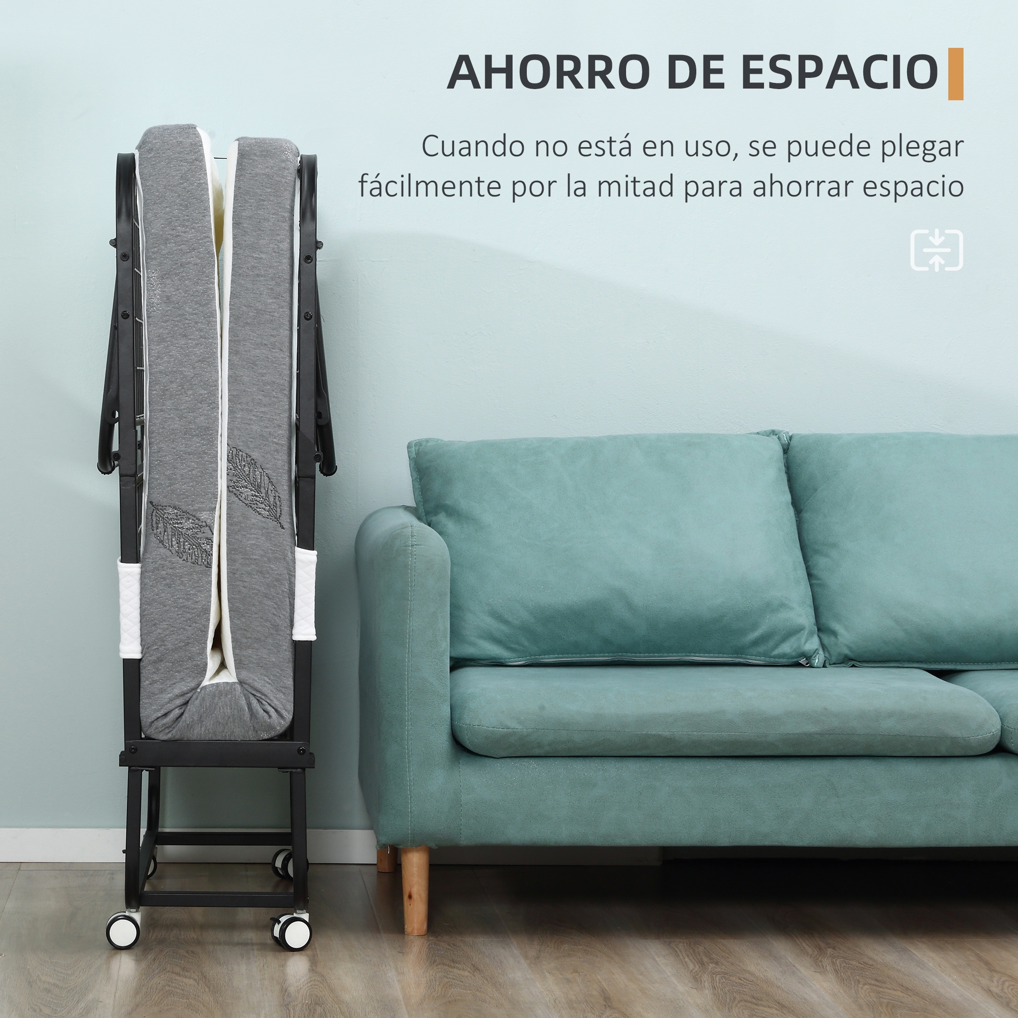 Una cama gris plegada con ruedas junto a un sofá turquesa.