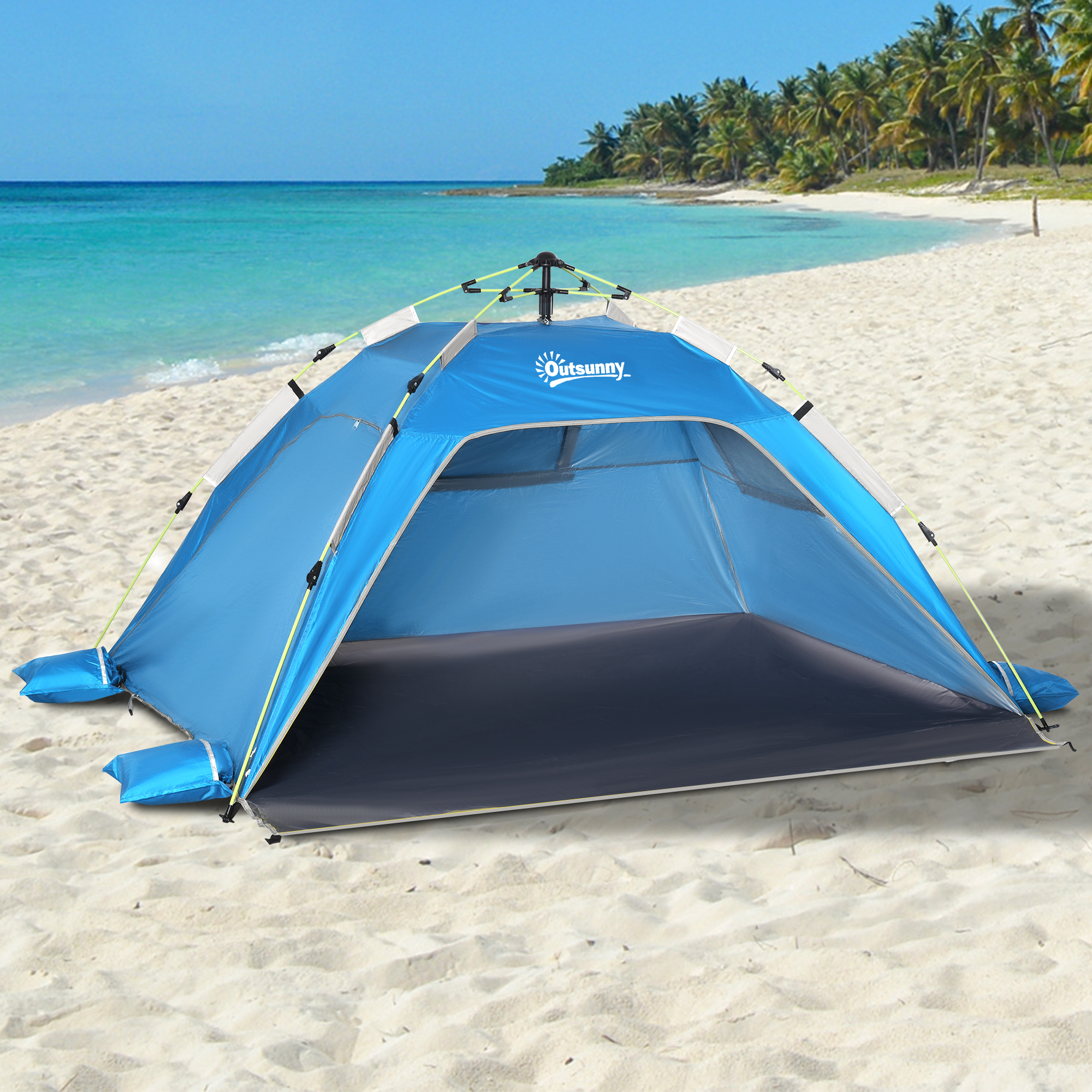 Una carpa de playa azul sobre arena, con palmeras y mar turquesa al fondo.