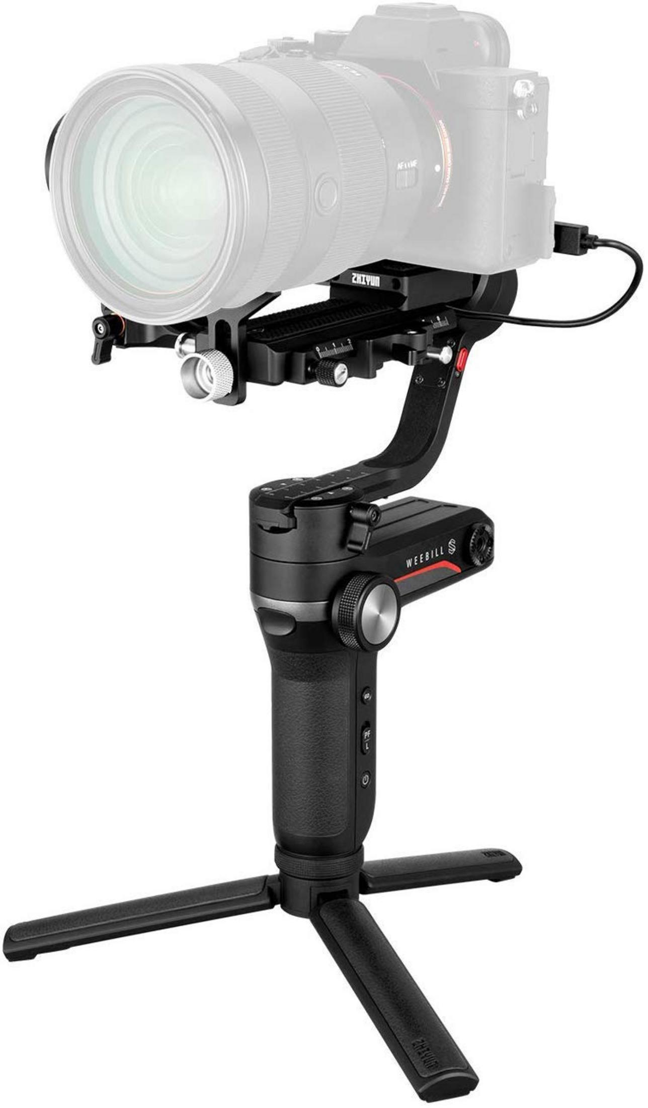 A black camera stabilizer with lens attached and a tripod base.