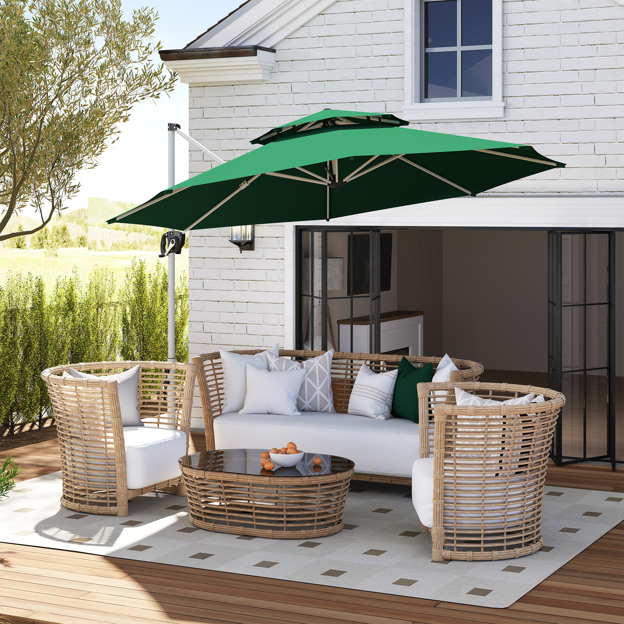Conjunto de muebles de exterior con sillas y sofá de ratán, sombrilla verde sobre la mesa.