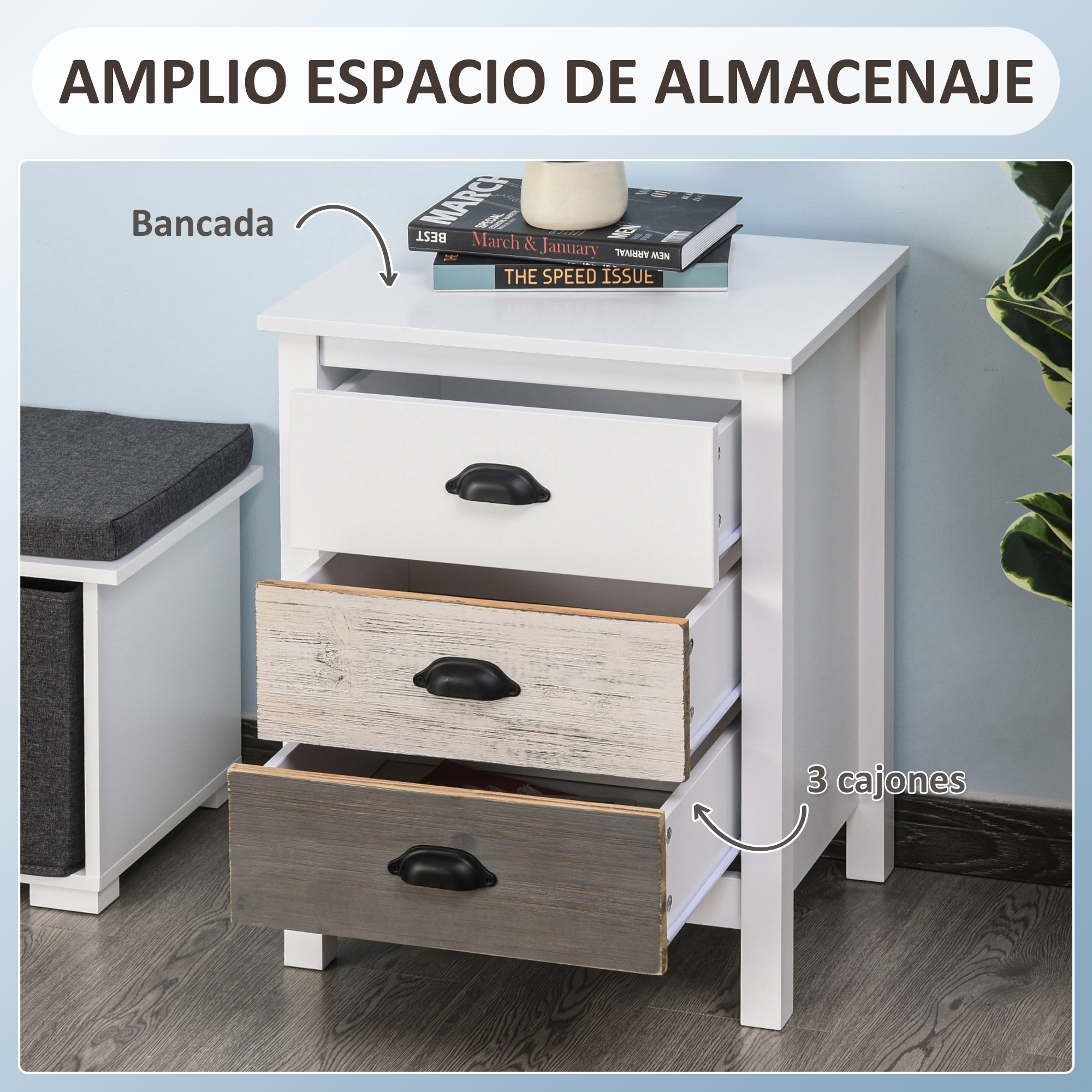 Mesita de noche blanca con tres cajones, uno con acabado de madera.
