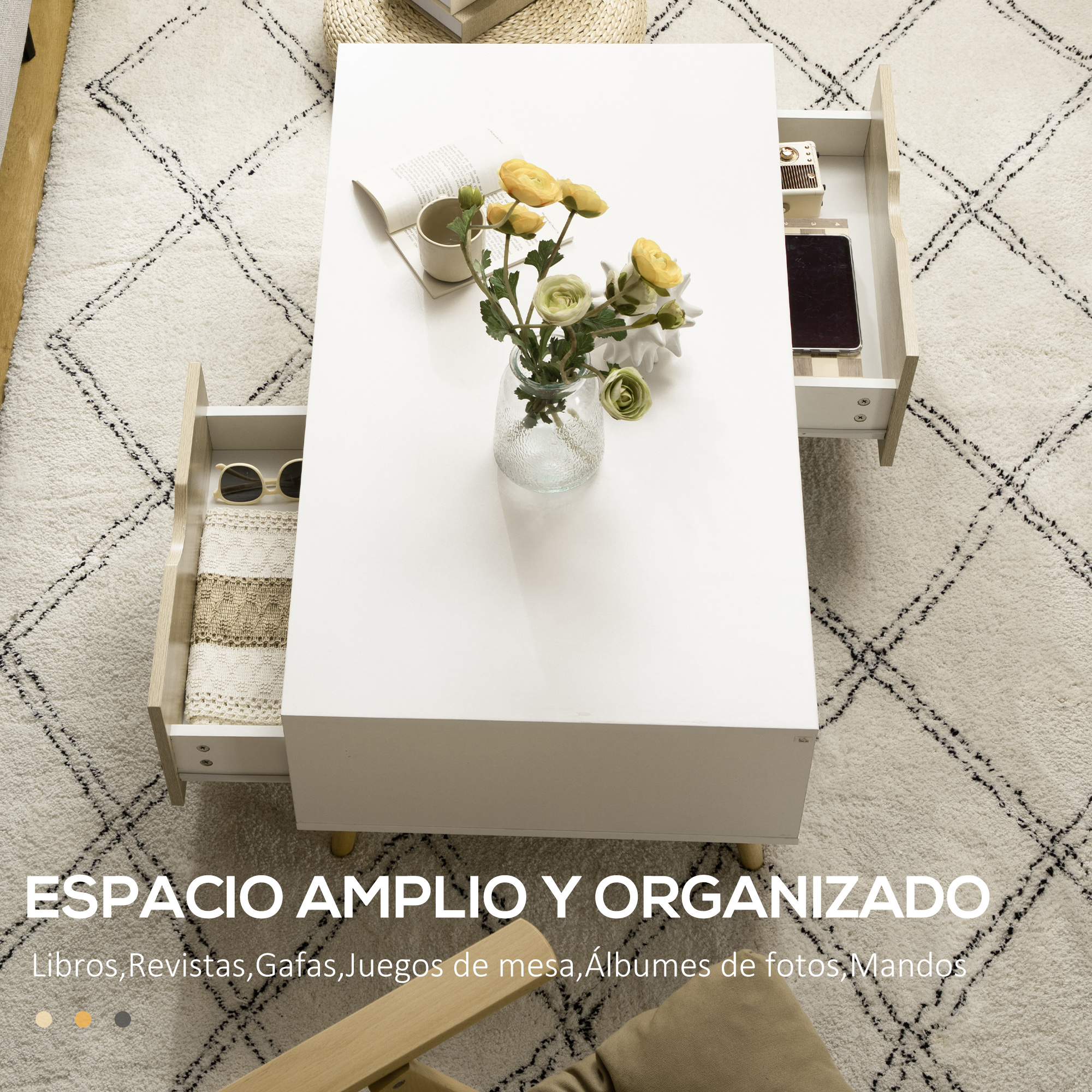 Una mesa de centro blanca con cajones abiertos sobre una alfombra de rombos.