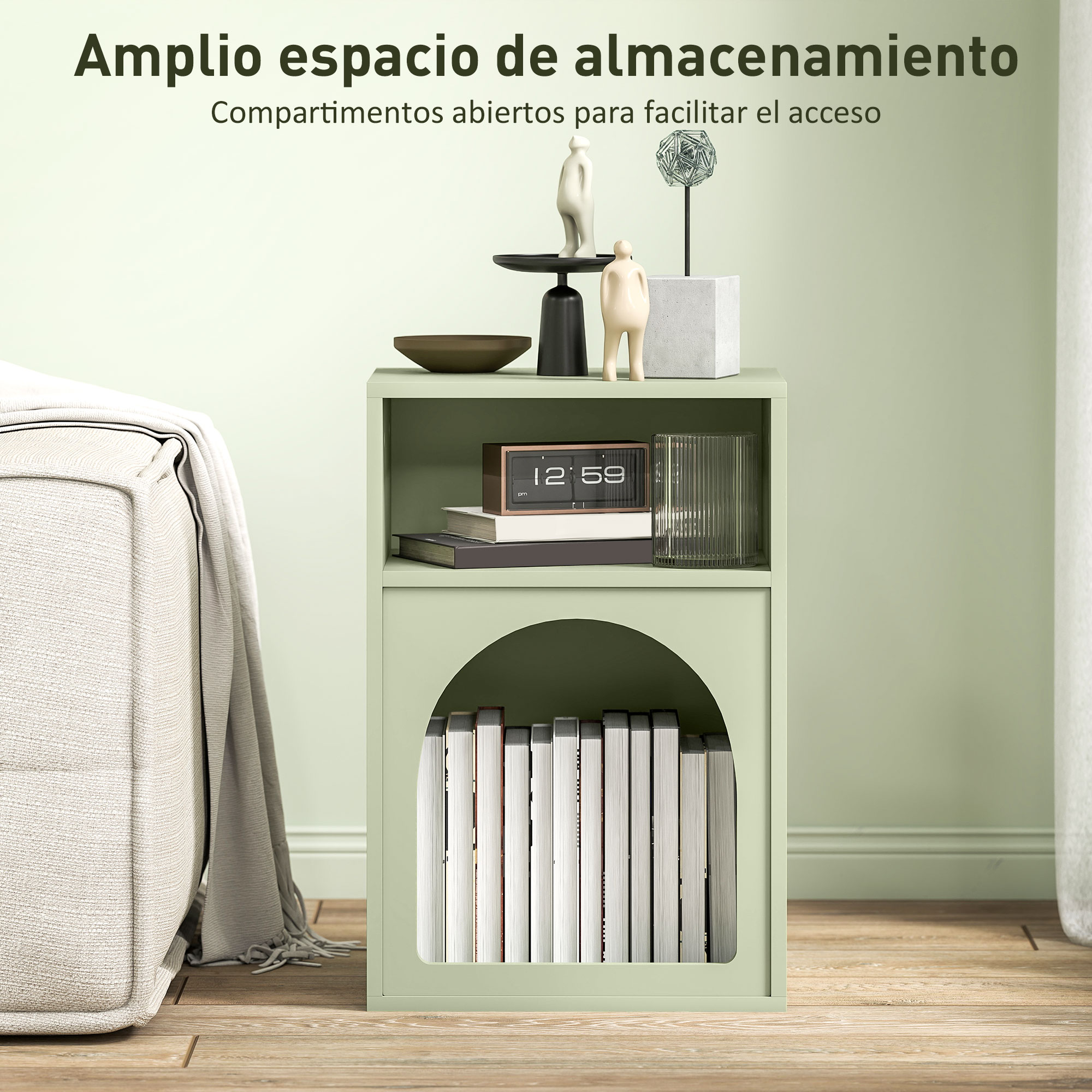 Un estante verde con libros y decoraciones, junto a un sofá con manta.