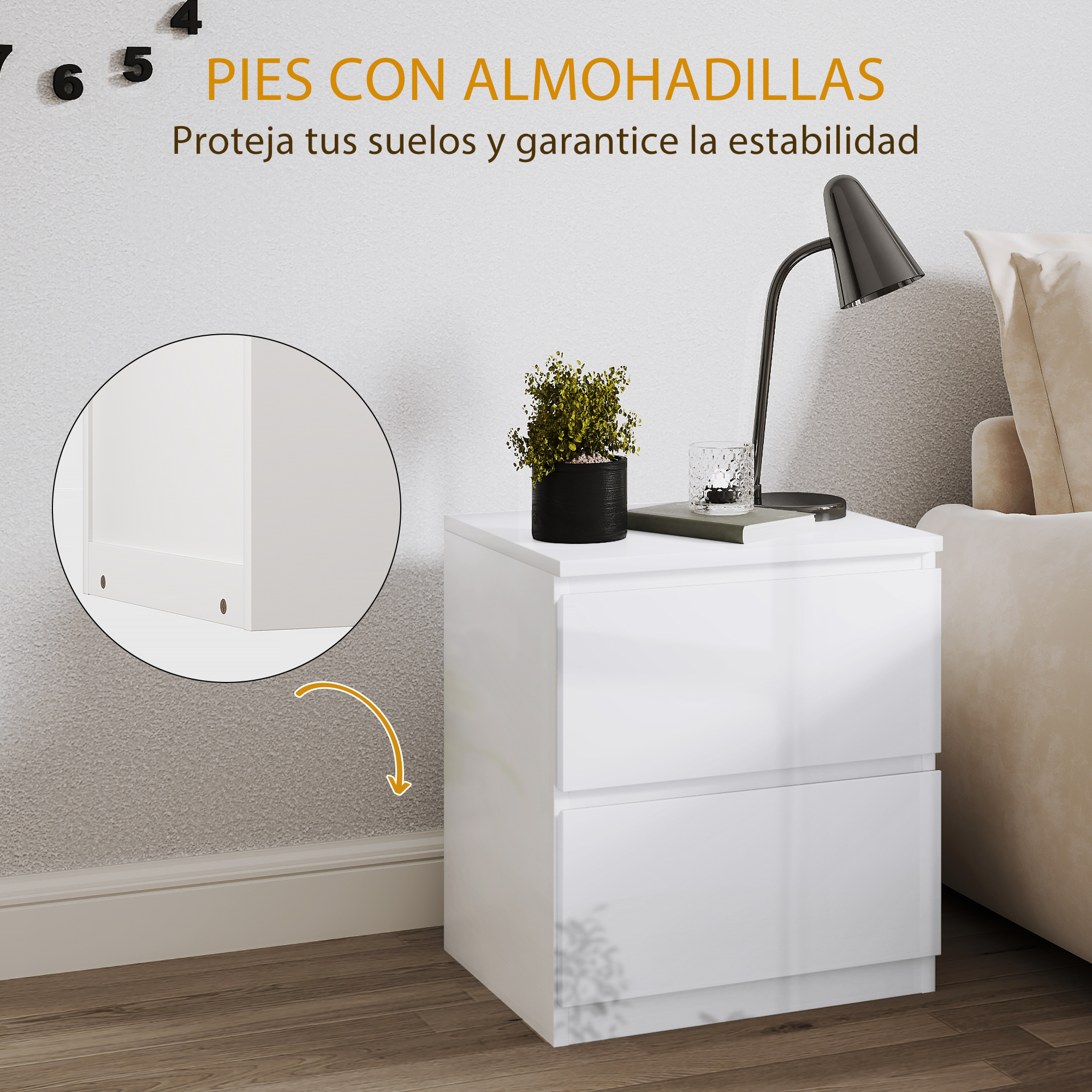 Mesita de noche blanca con dos cajones, lámpara, planta y vaso.