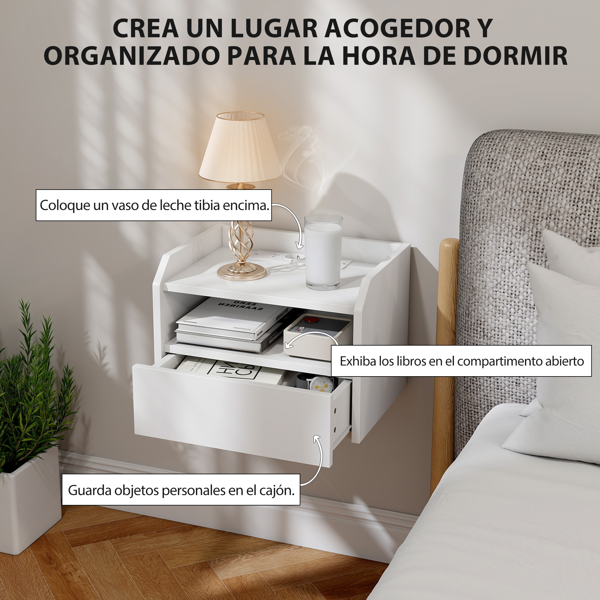 Un velador blanco junto a una cama con libros, lámpara y leche.