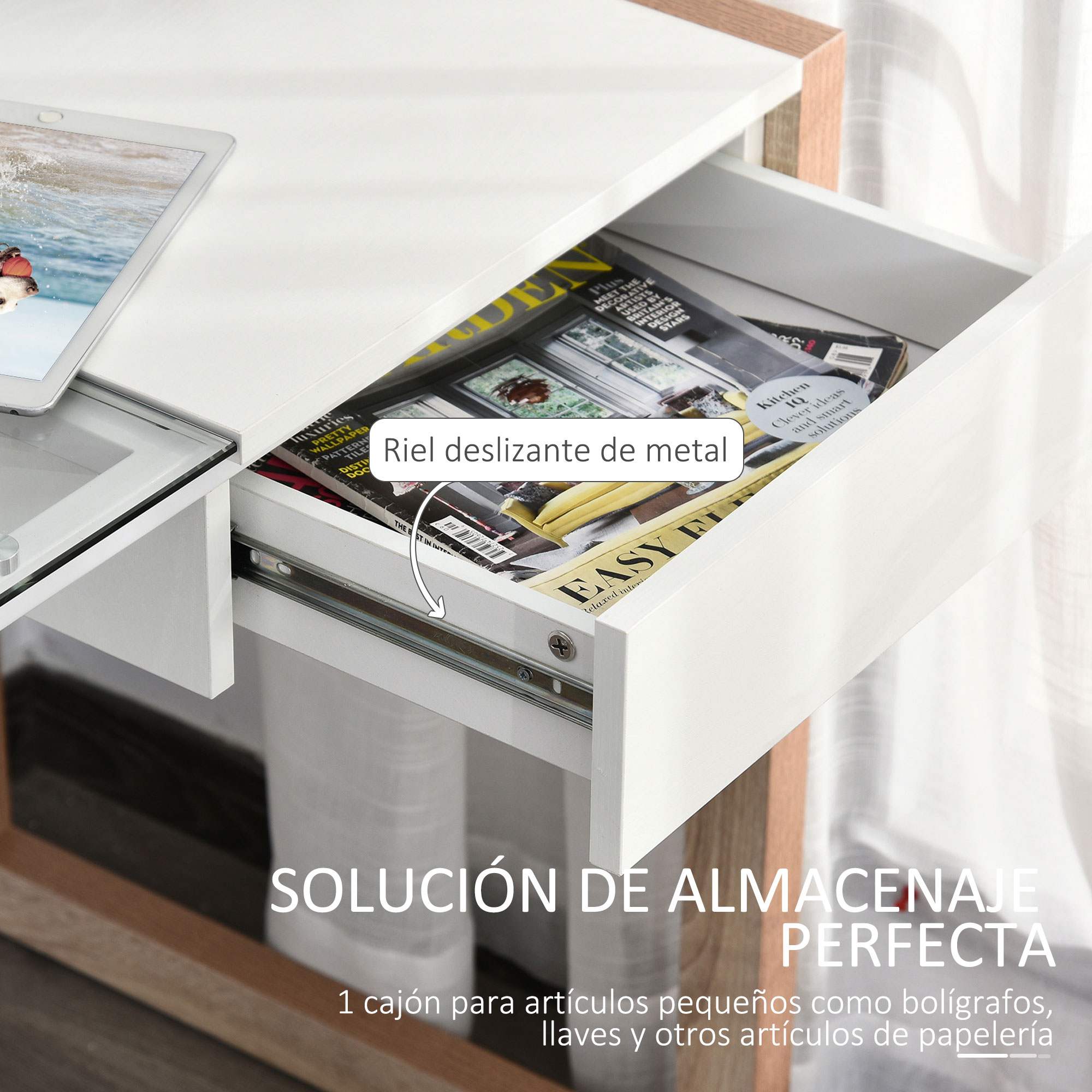Un cajón abierto con revistas y una tableta sobre una superficie blanca.