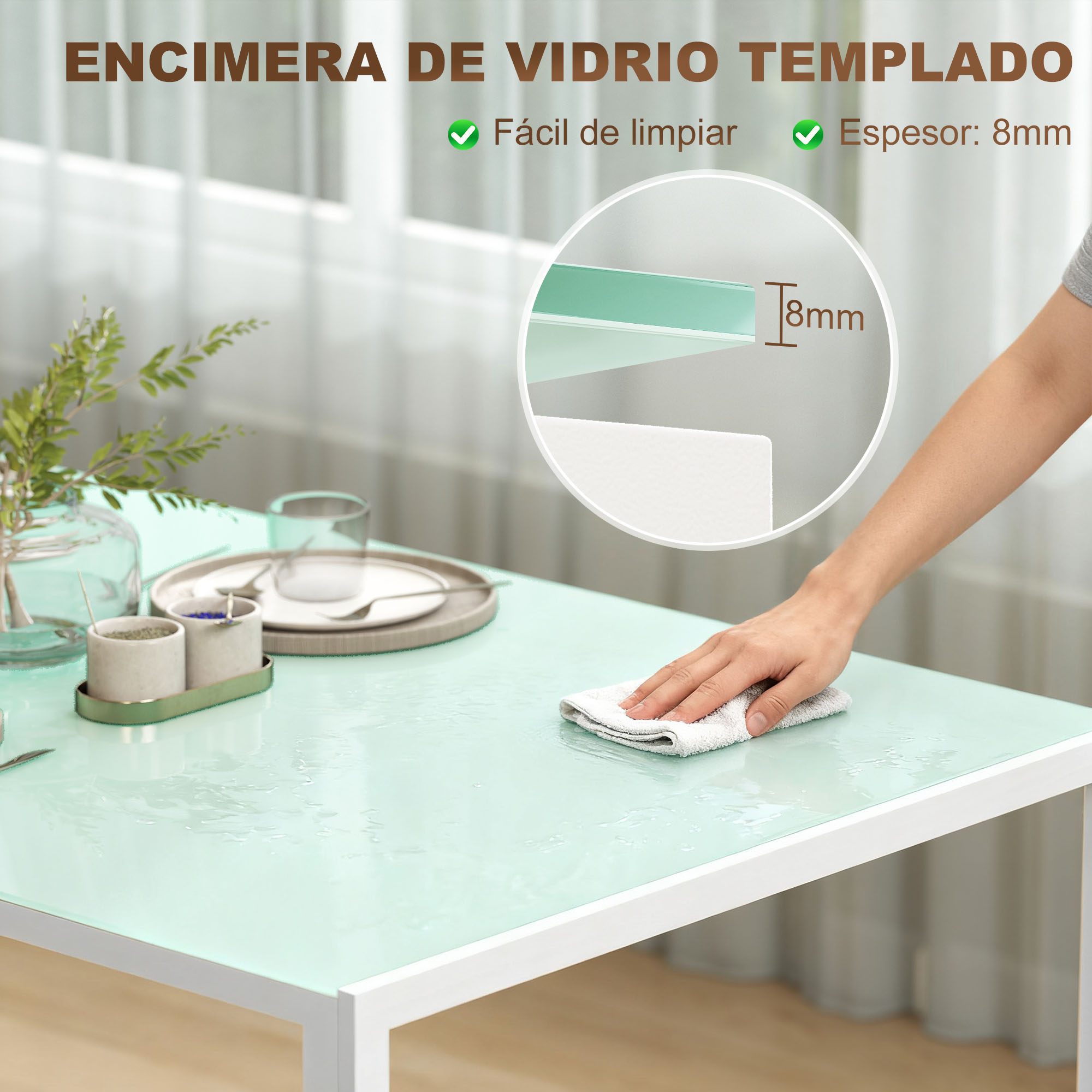 Una mano limpia un tablero de vidrio verde claro brillante con un paño blanco.