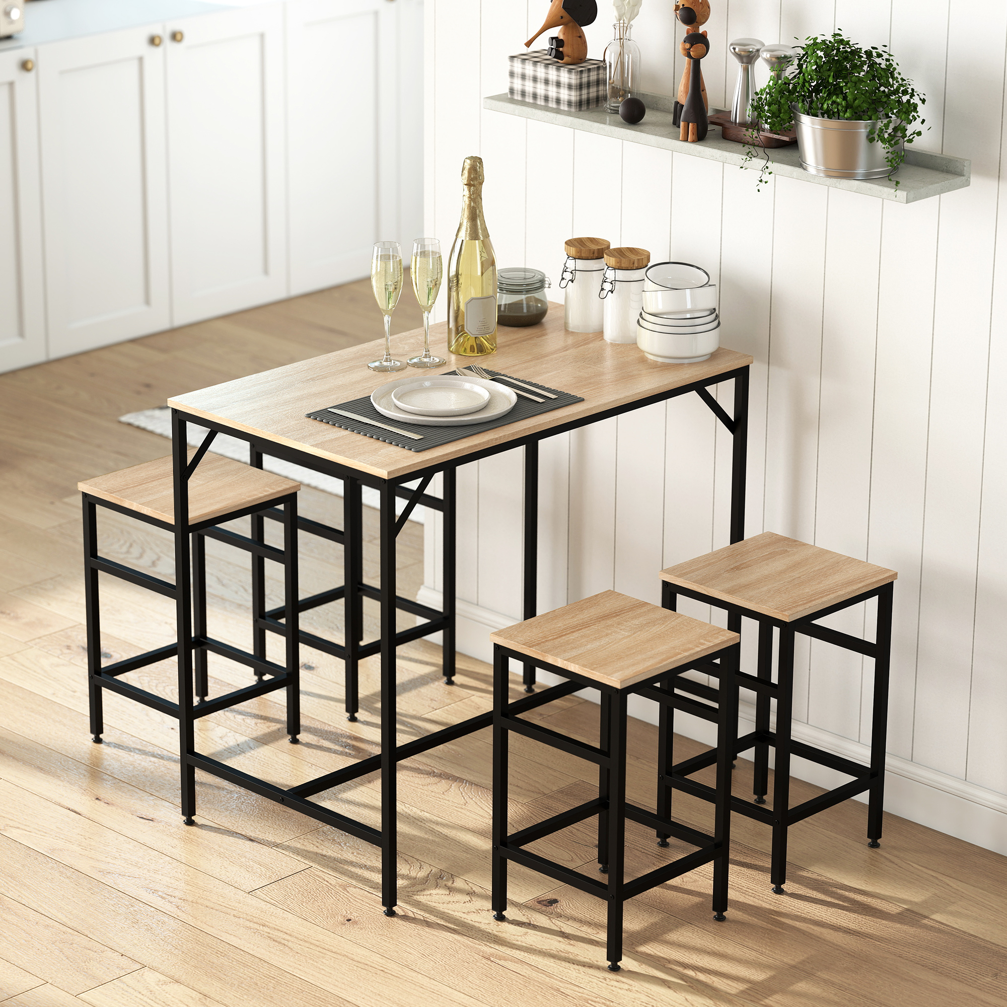 Una mesa de madera con cuatro taburetes altos, botella de champán, copas y cuencos.
