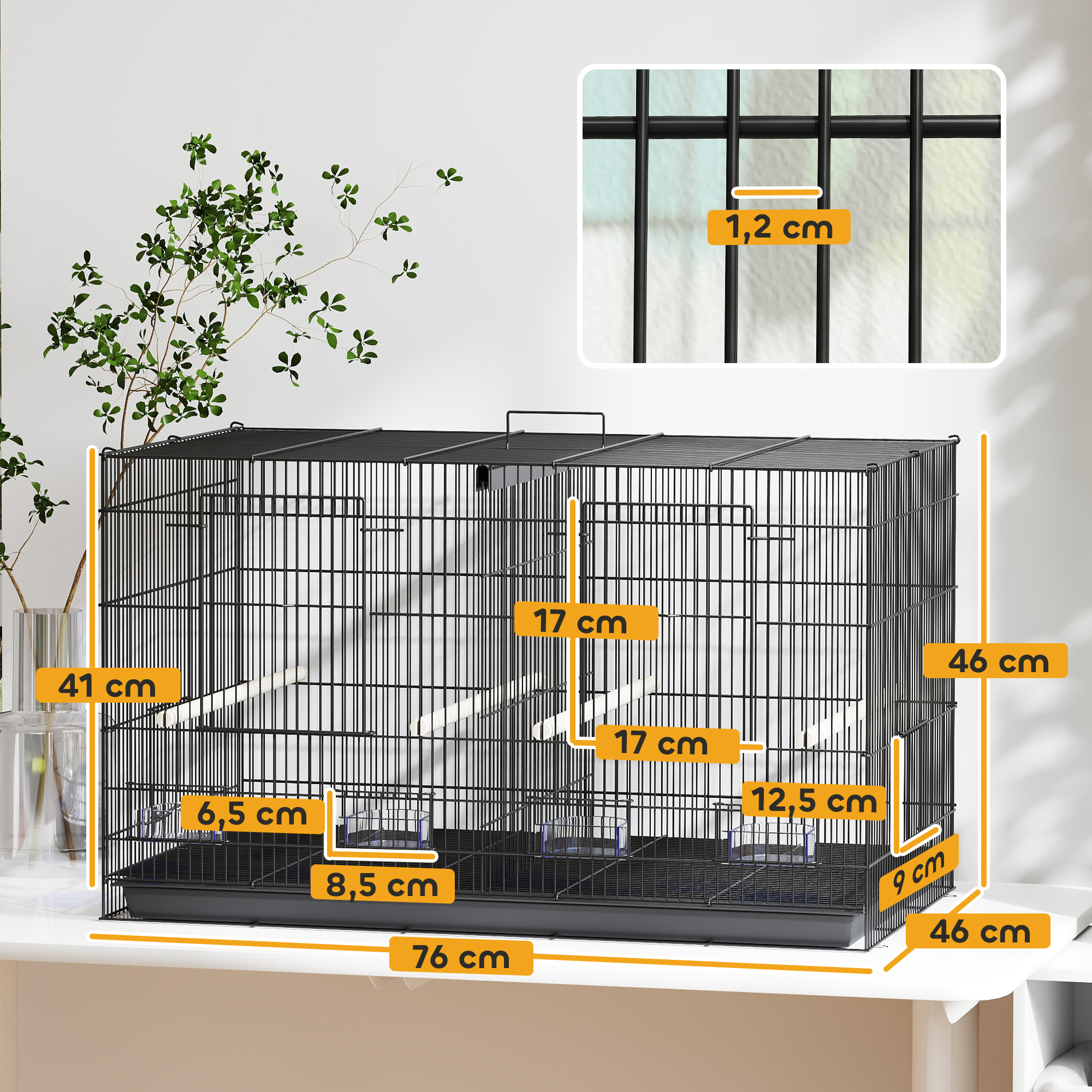 Jaula negra para pájaros con dimensiones indicadas. Incluye comederos y perchas.