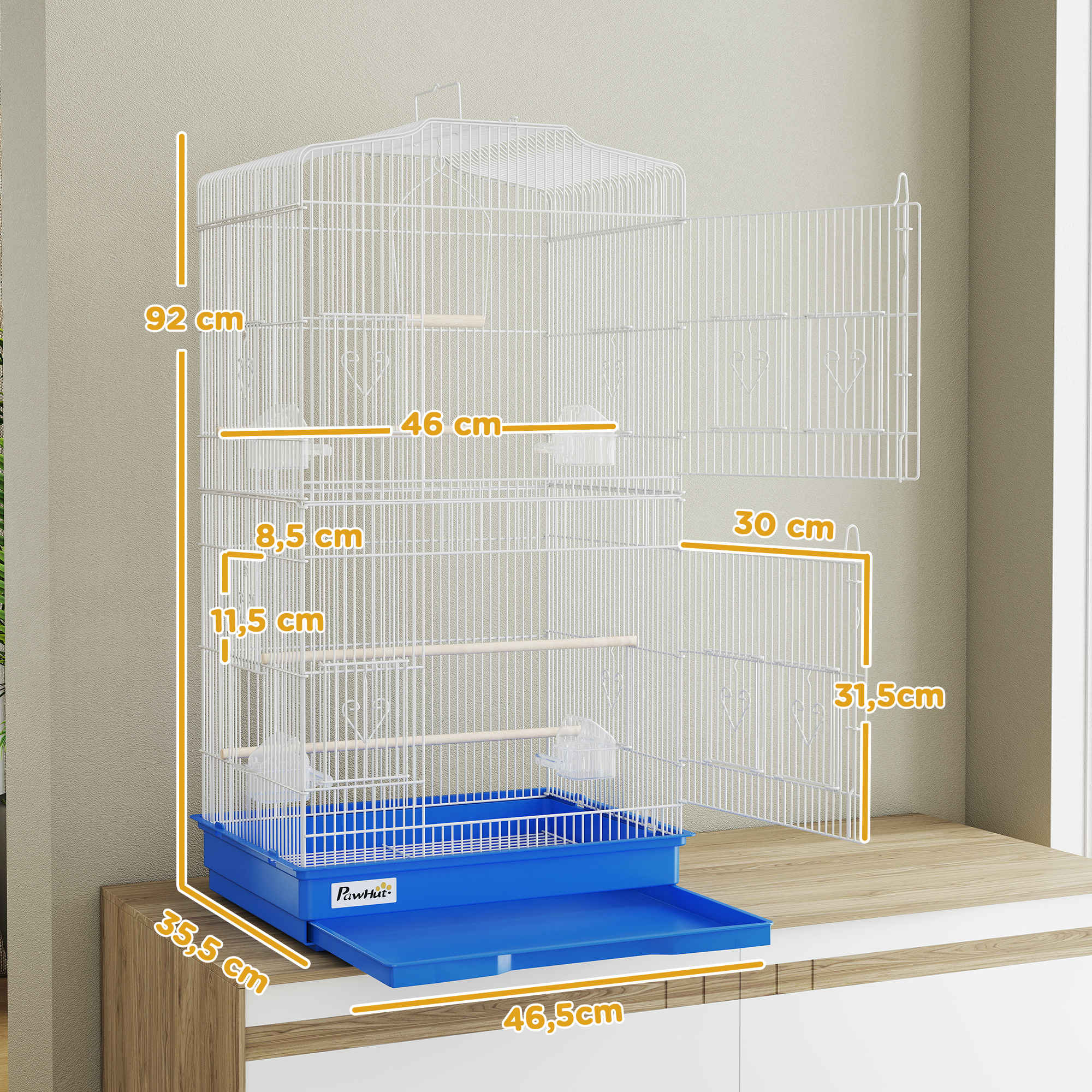 Una jaula blanca para pájaros con cajón azul está sobre un mueble de madera. Se muestran dimensiones.