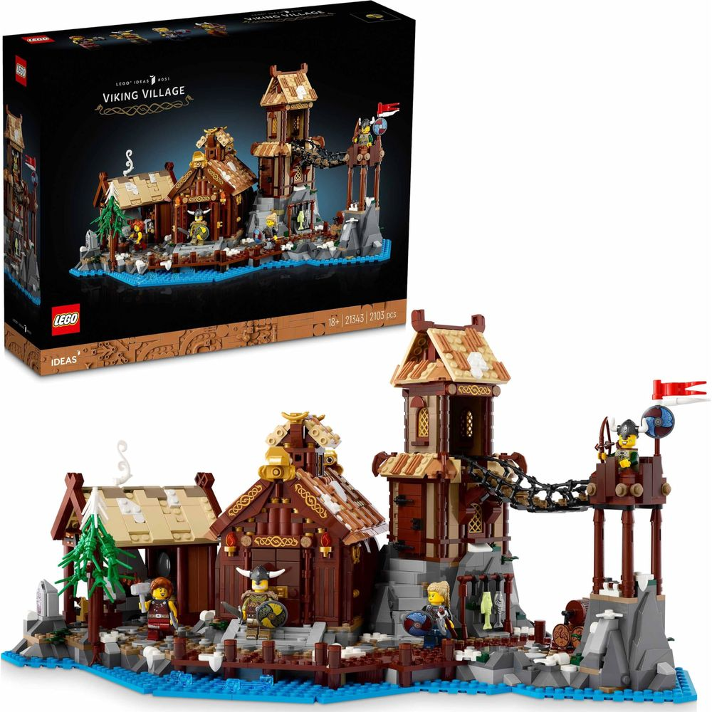 Model Lego Wioska Wikingów z drewnianymi budynkami, mostem i postaciami na niebieskiej wodzie.