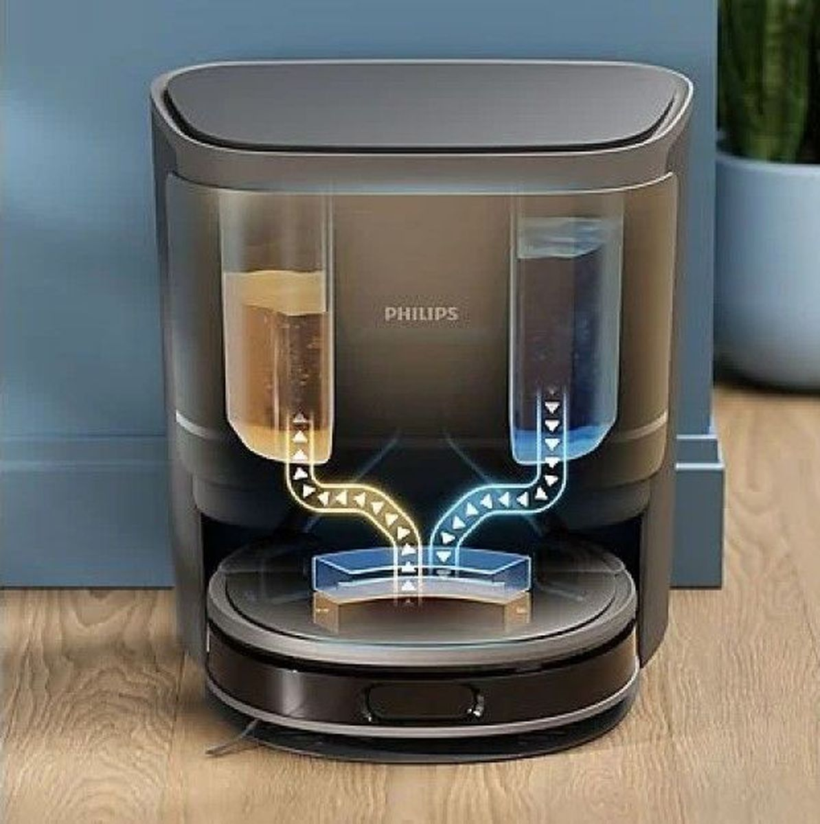 Odkurzacz automatyczny z dwoma zbiornikami, wypełnionymi żółtym i niebieskim płynem.