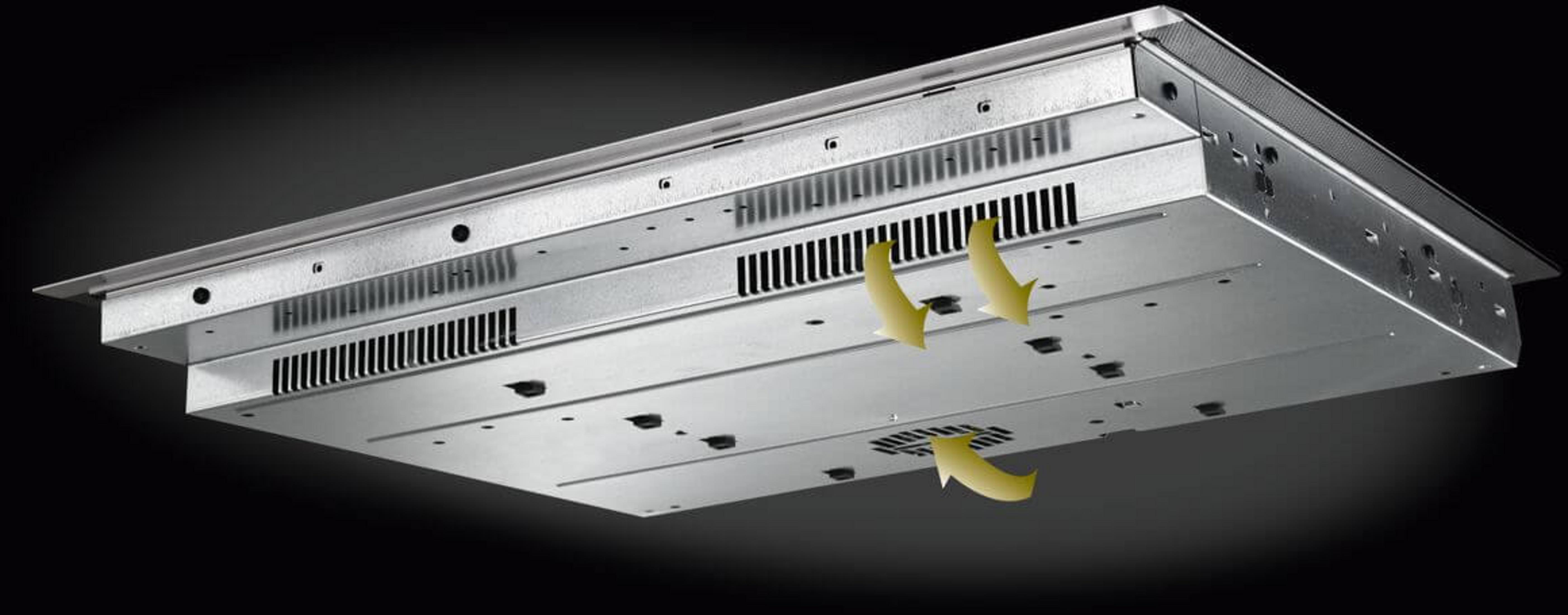 Spód płyty grzewczej z otworami wentylacyjnymi i strzałkami wskazującymi przepływ powietrza.